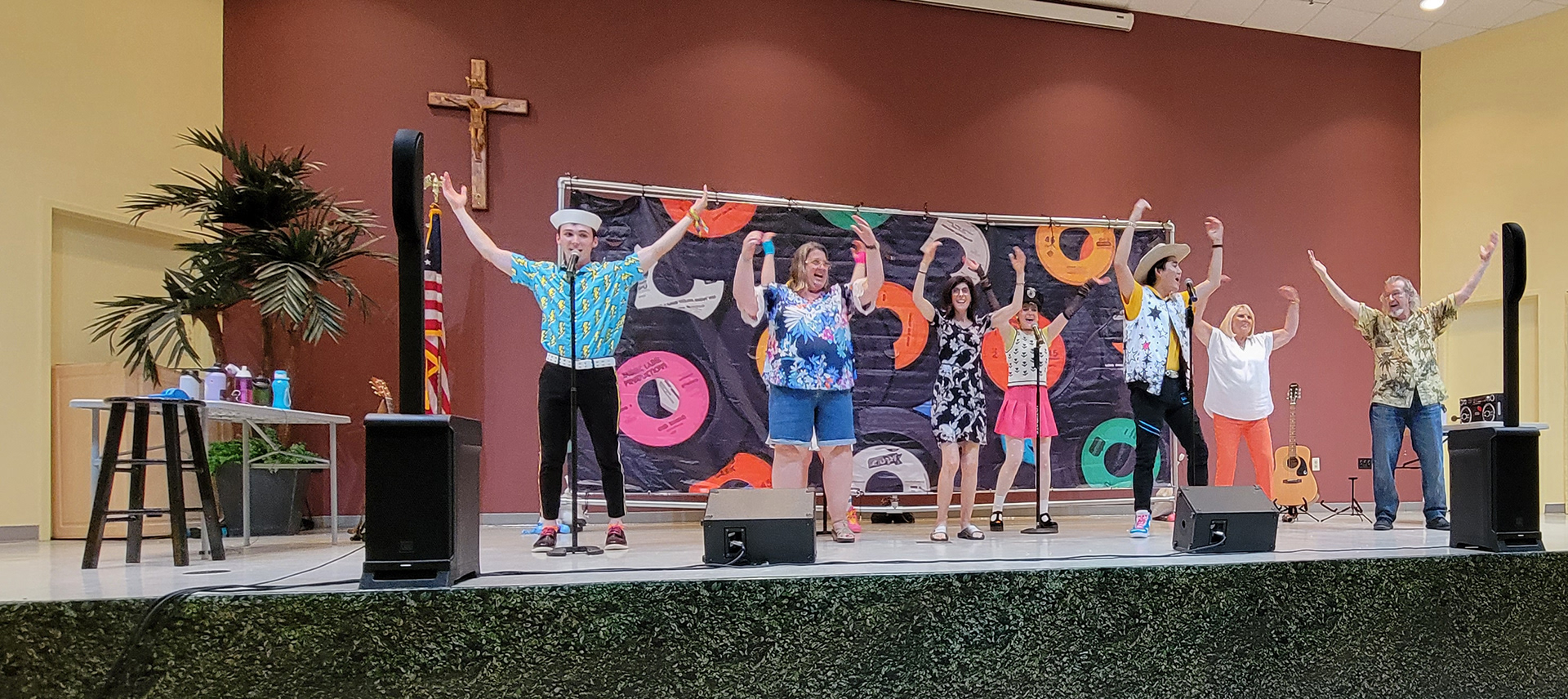 Picutred: Harry Shaull, Linnzie Hays, Gemma Vodacek, Caleb Lee and audience volunteers perform the YMCA during performance of Off the Charts!