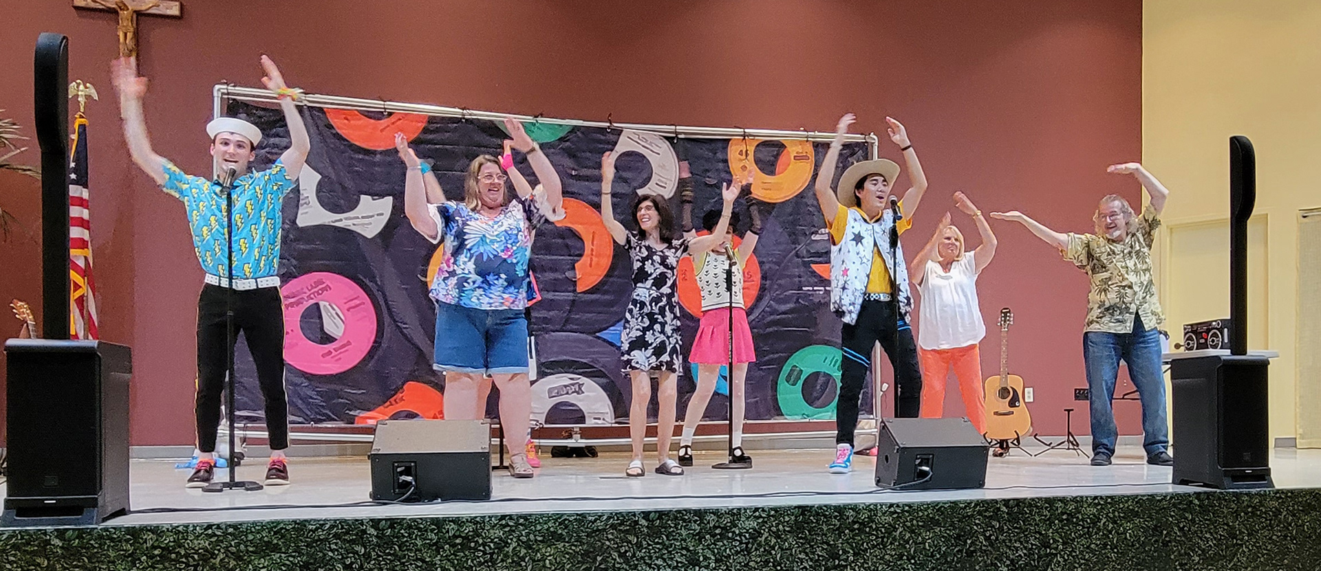 Picutred: Harry Shaull, Linnzie Hays, Gemma Vodacek, Caleb Lee and audience volunteers perform the YMCA during performance of Off the Charts!