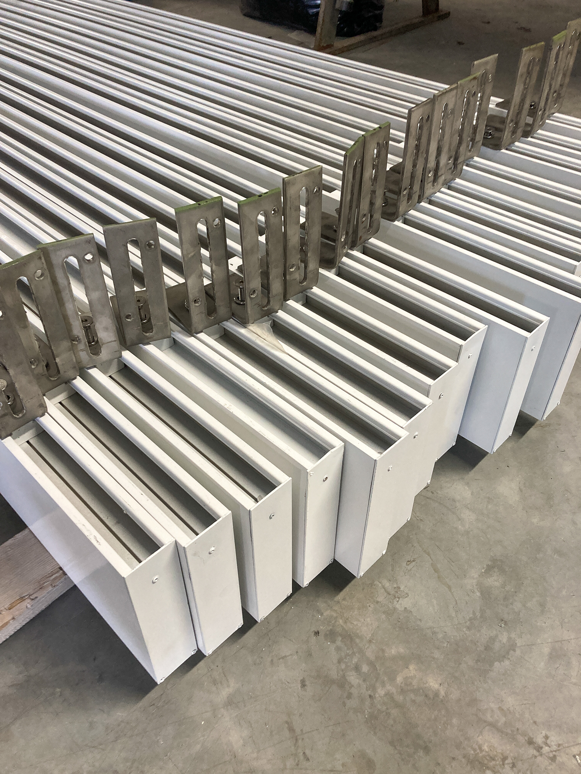 Stainless brackets for mounting architectural trim