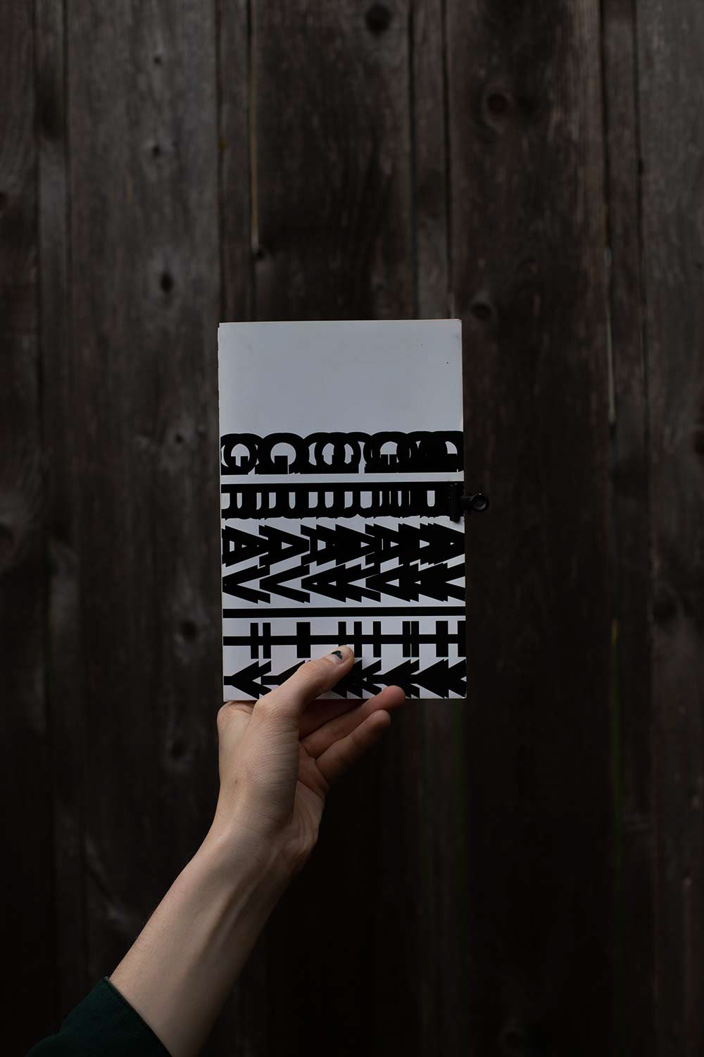 Photograph of Dev holding Gravity Jokes Publication.