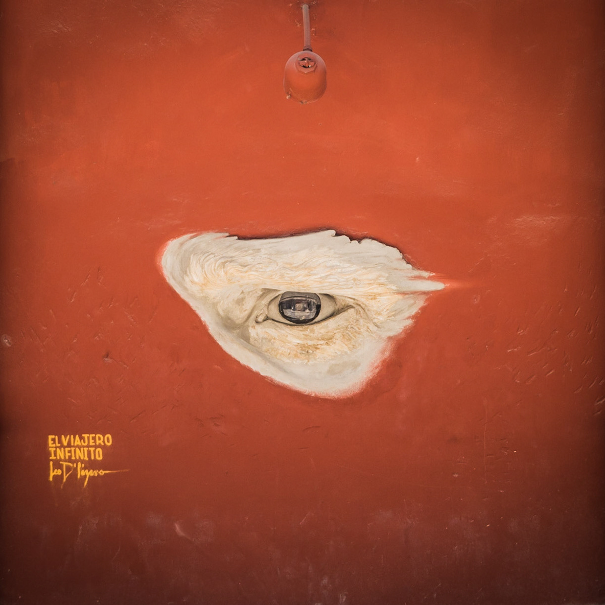 A huge eye looks out from a wall on a street in Havana, Cuba