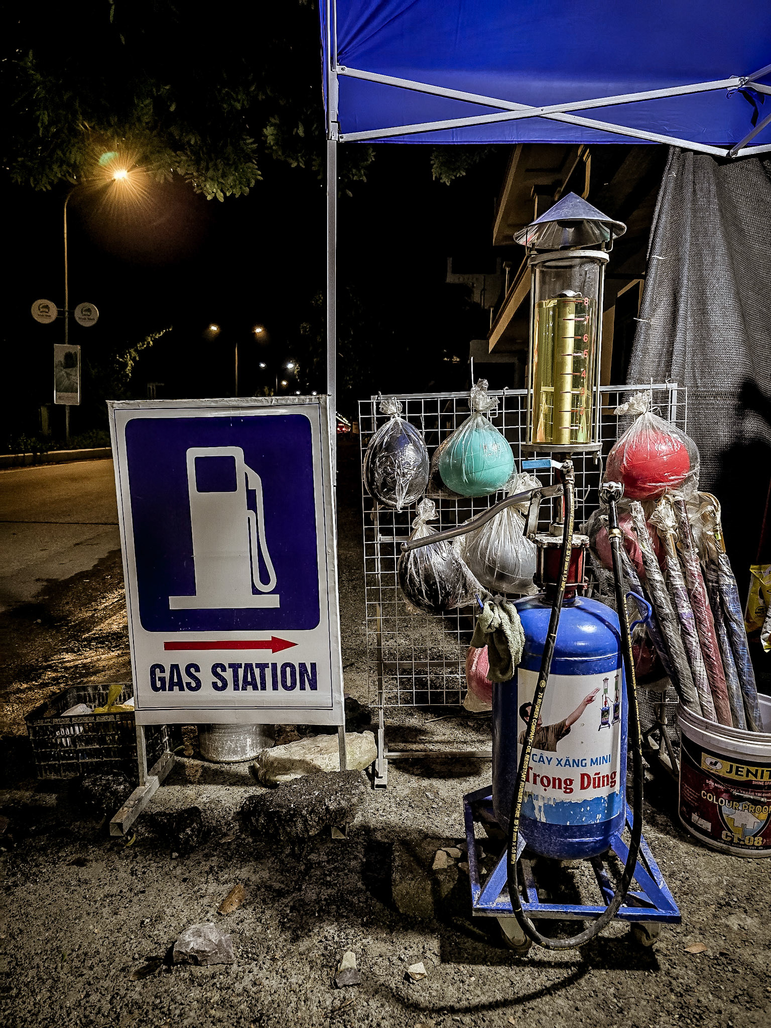 A rural petrol station stands quiet on a roadside in the Ninh Binh region of Vietnam