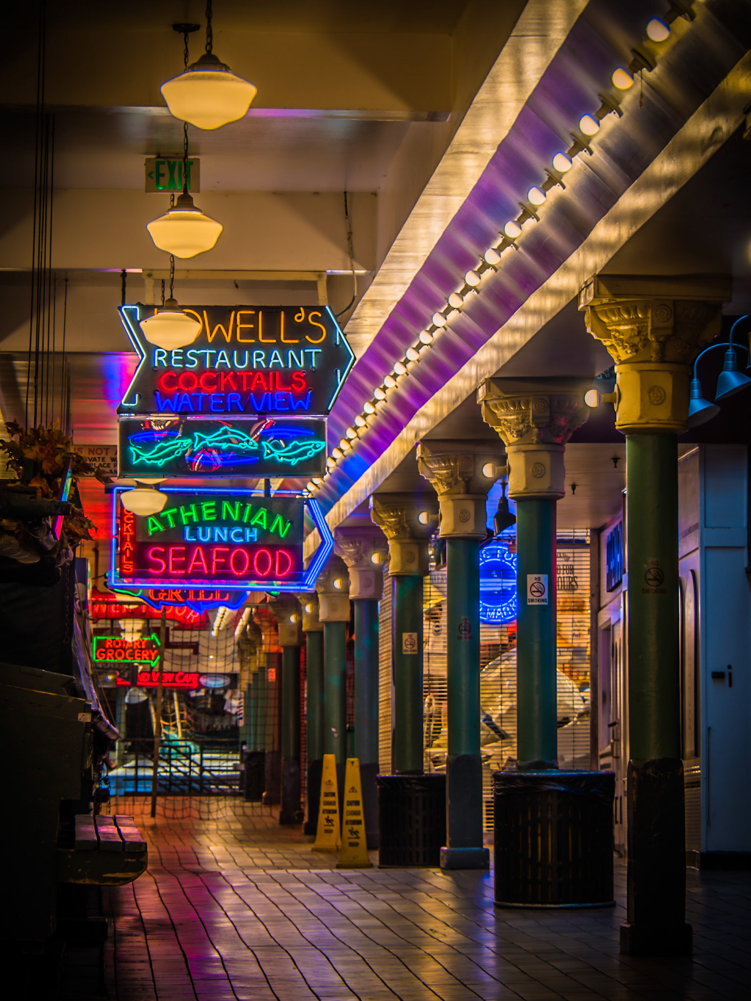 The colourful neon signs of Pike Place Market in Seattle, shuttered for the evening