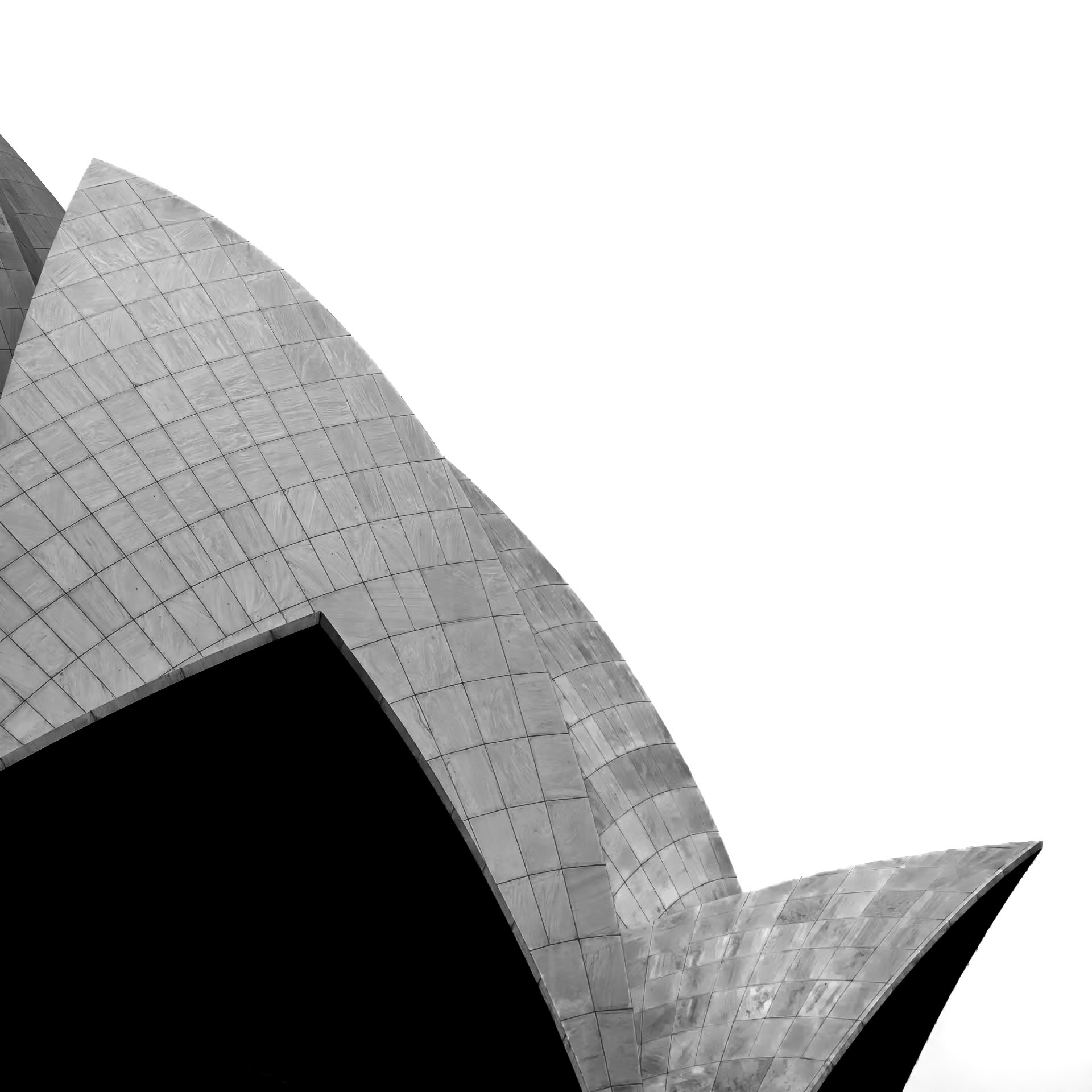 The shell-like roof of the Lotus Temple casts a distinctive shape against the New Delhi skyline