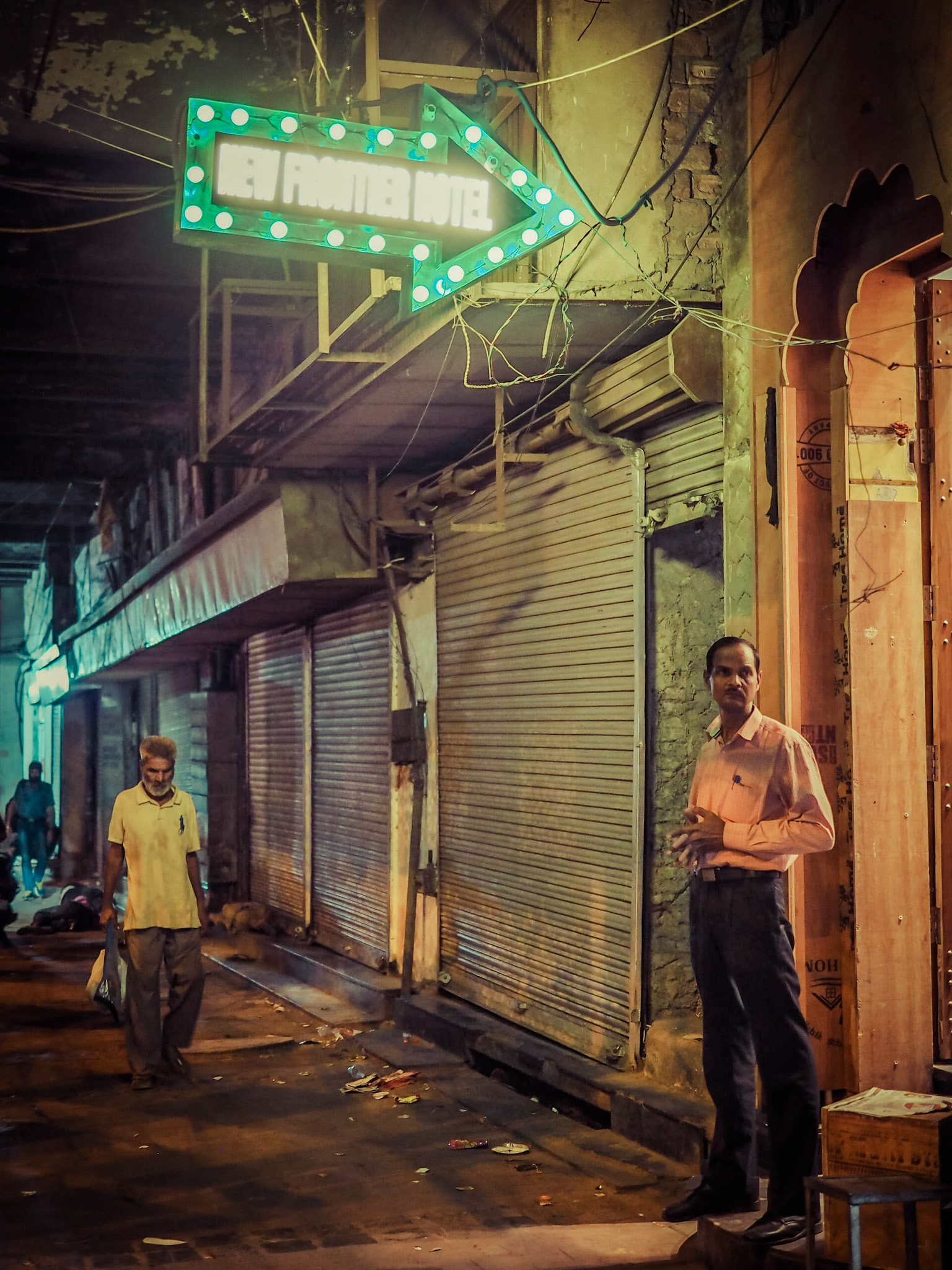 A hotel owner awaits his next guests in the Chandni Chowk market district of New Delhi