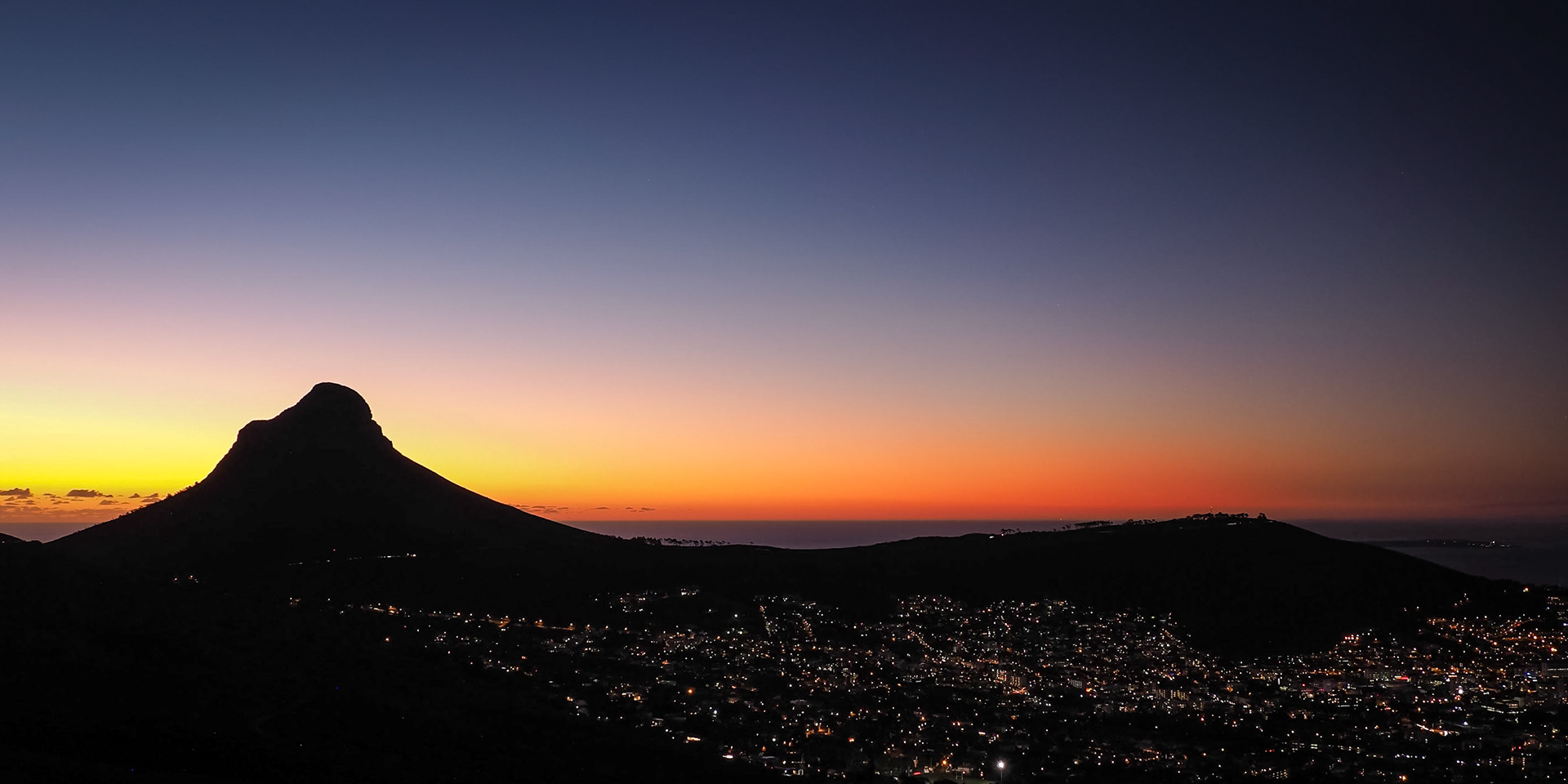 Dusk settles behind the Lions Head in Cape Town, South Africa