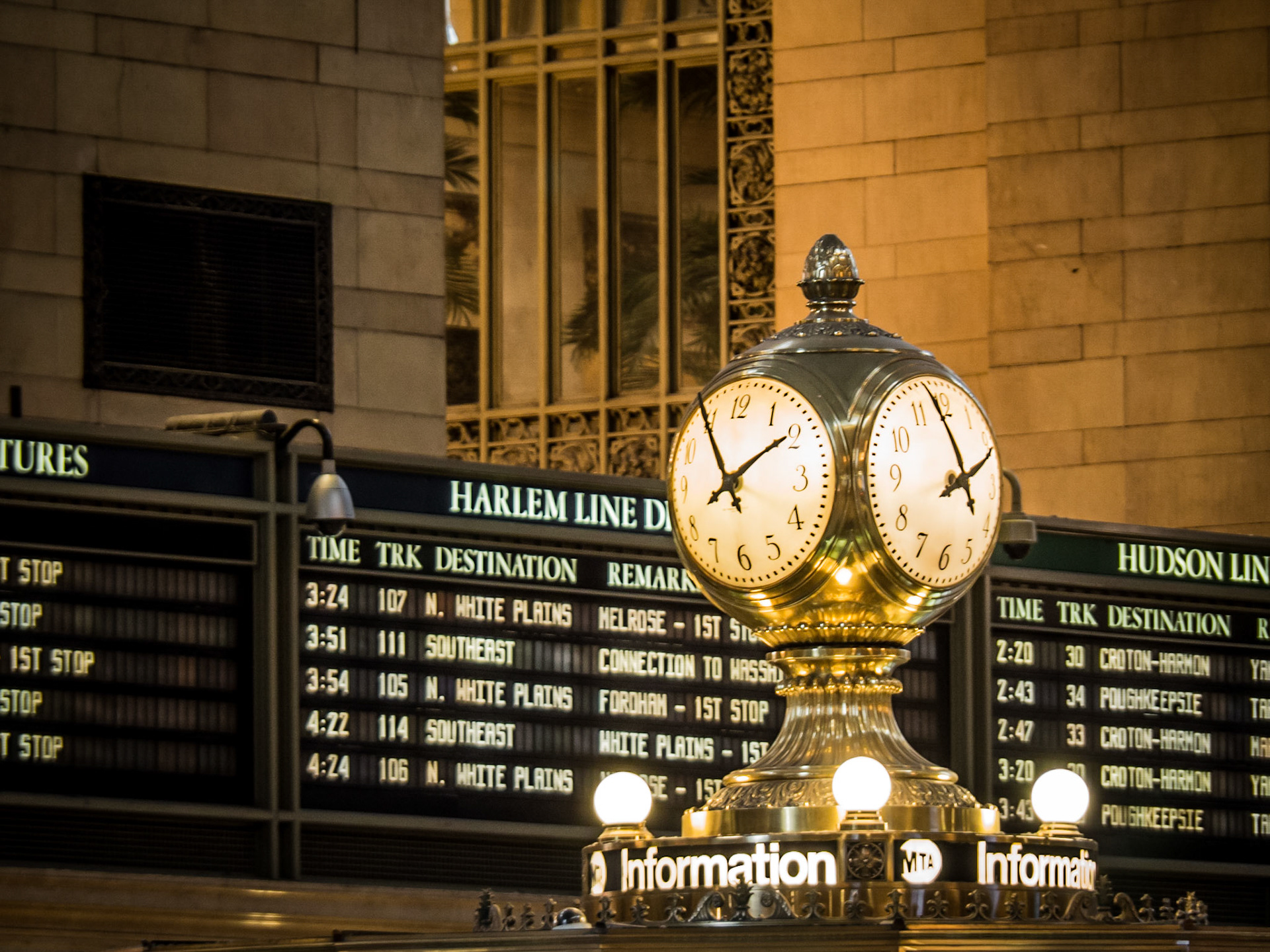 Departure boards behind the famous clock on the concourse of Grand Central Terminal in Manhattan. New York