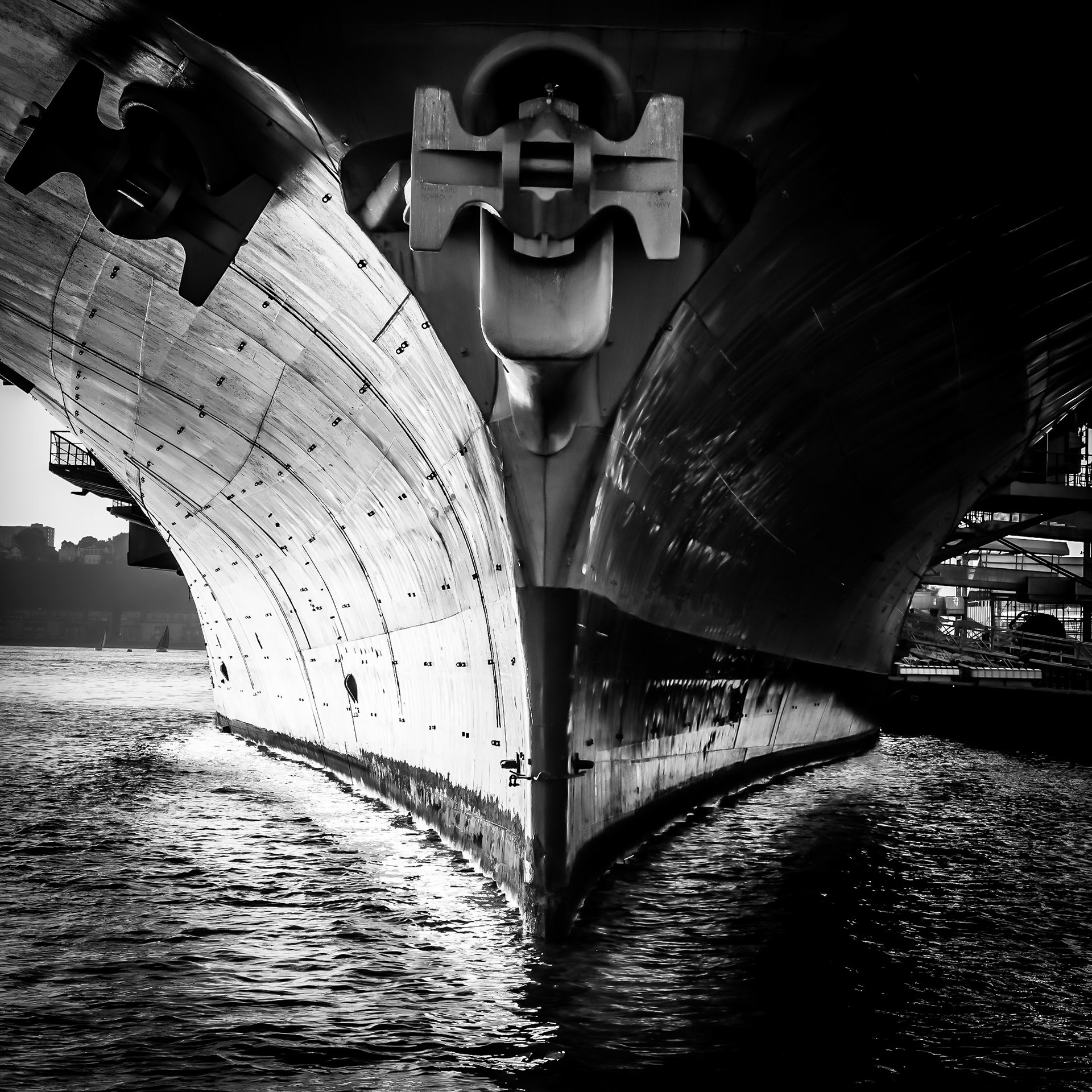 The prow of the USS Intrepid imposes on the Hudson riverfront in Manhattan, New York