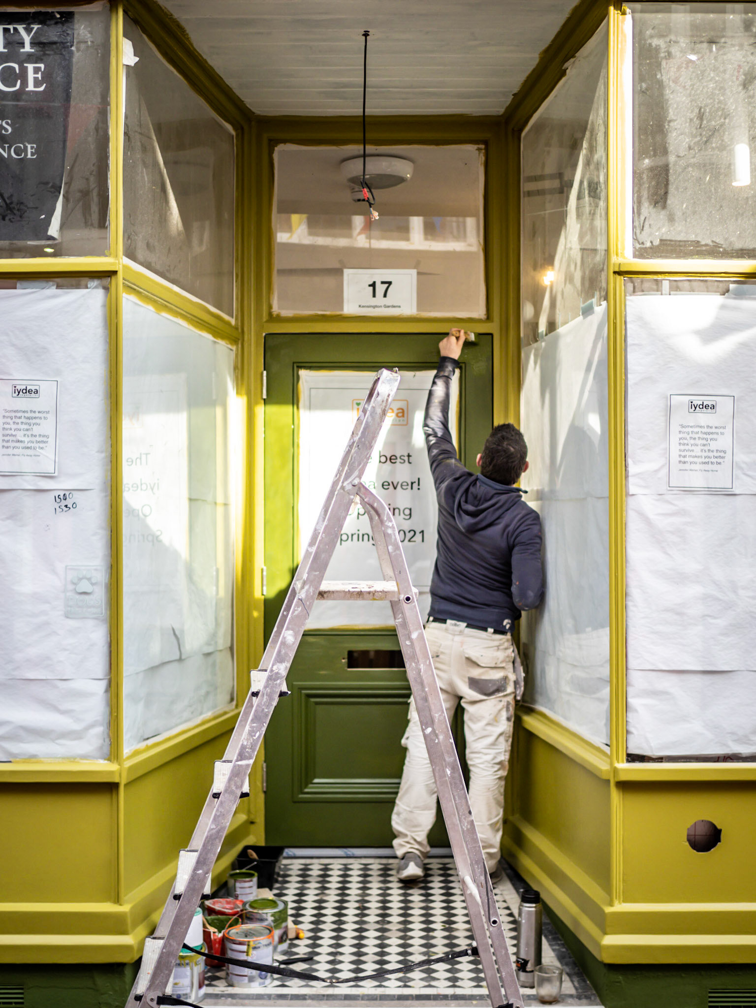 A shop-owner gives his store-front a fresh lick of paint ready for the return of customers to the North Laine area of Brighton