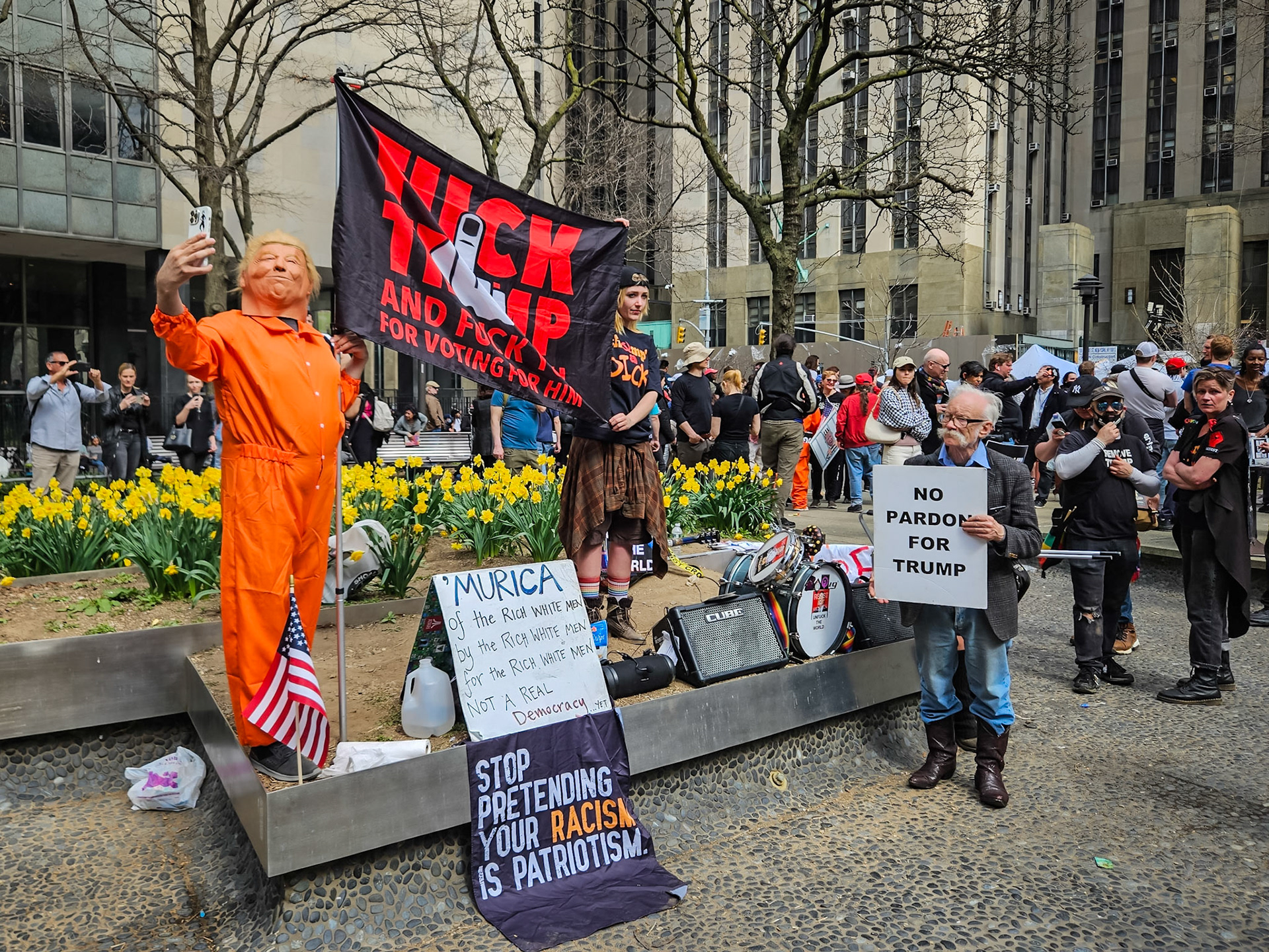 A crowd of protesters gathers outside the New York court house where former President Donald Trump is arraigned on multiple criminal charges