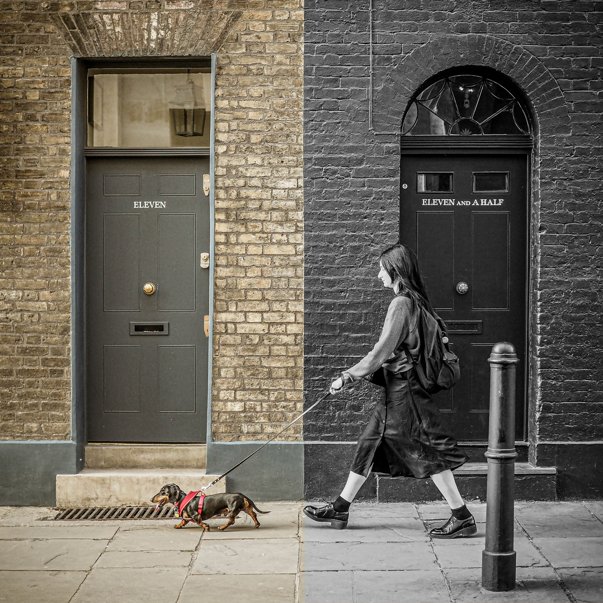 A woman walks her dog along an unusual street in London