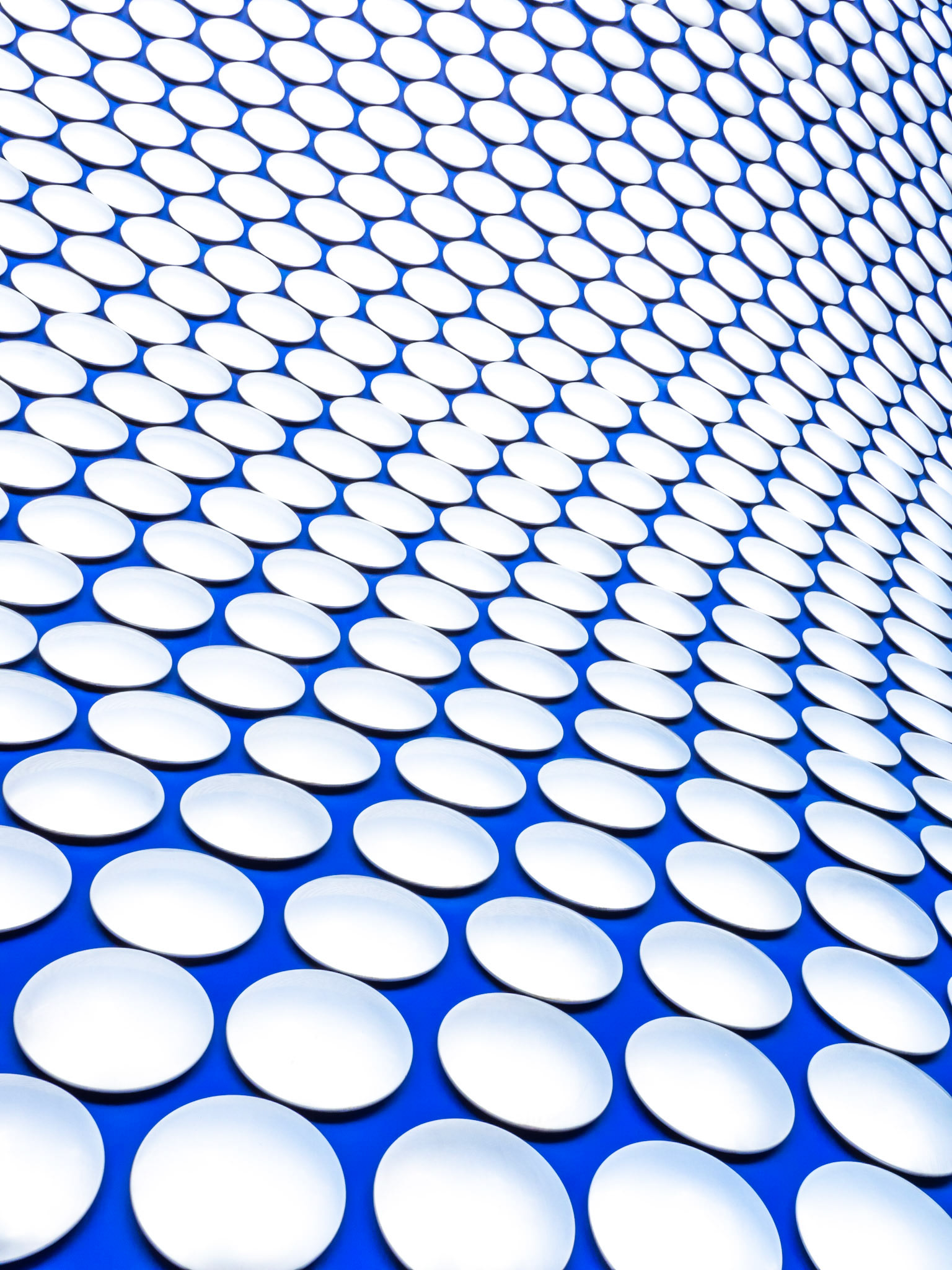 Bright dots lie against a vivid blue background