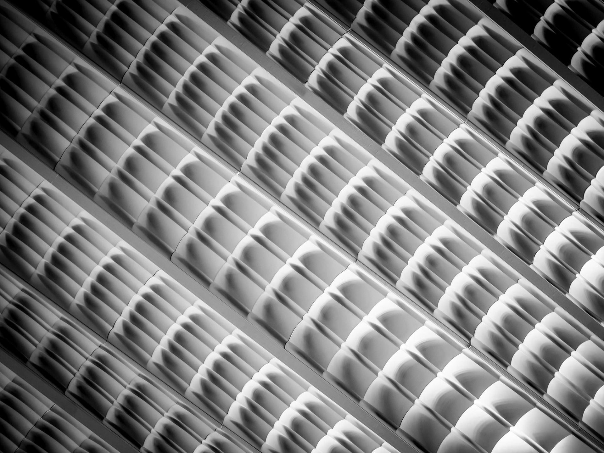 The dune-like characteristics of a ceiling of an indoor market in the Lower East Side district of Manhattan, New York