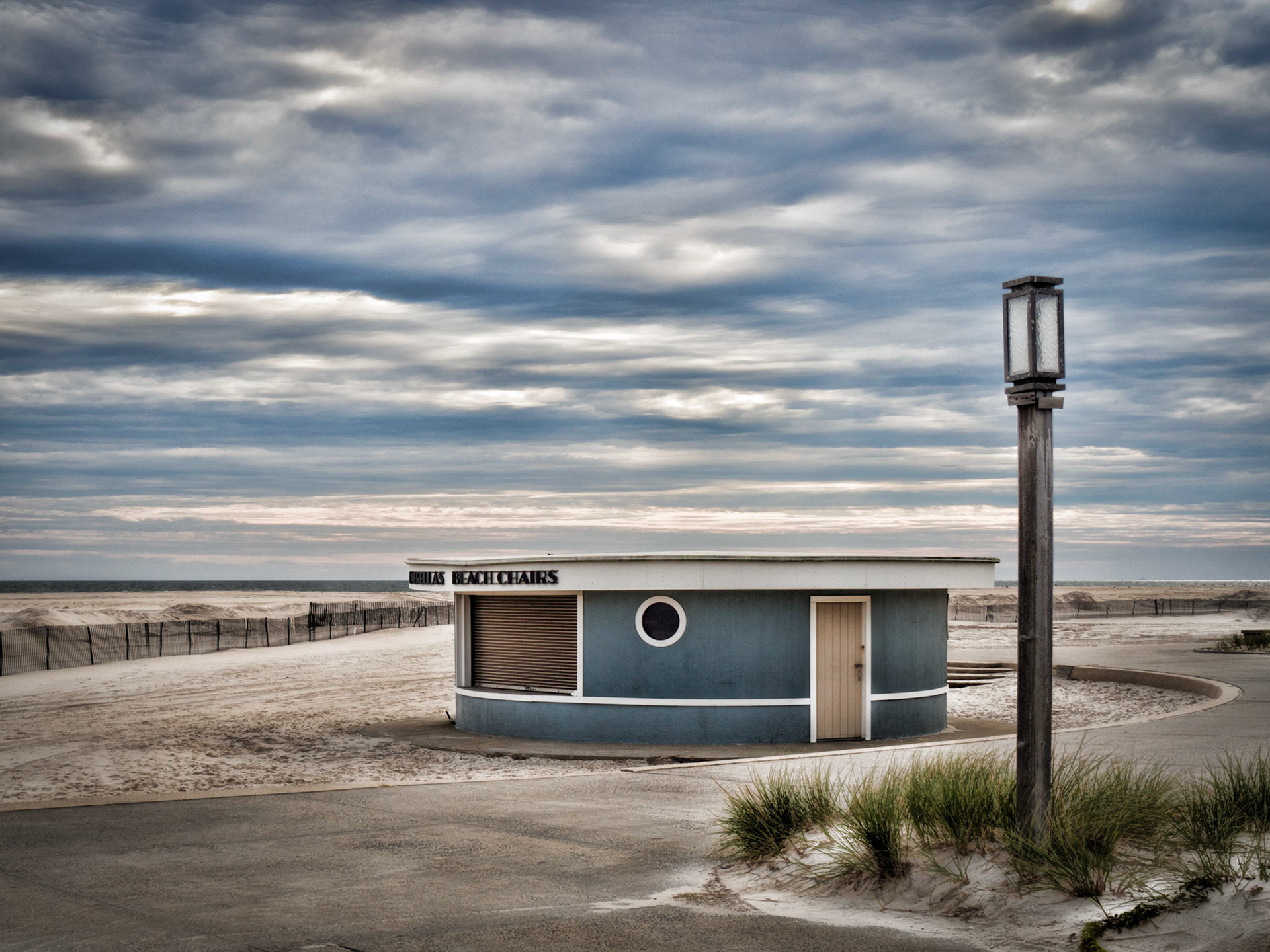 A hut renting umbrellas and beach chairs lies shuttered for the winter on Jones Beach on Long Island