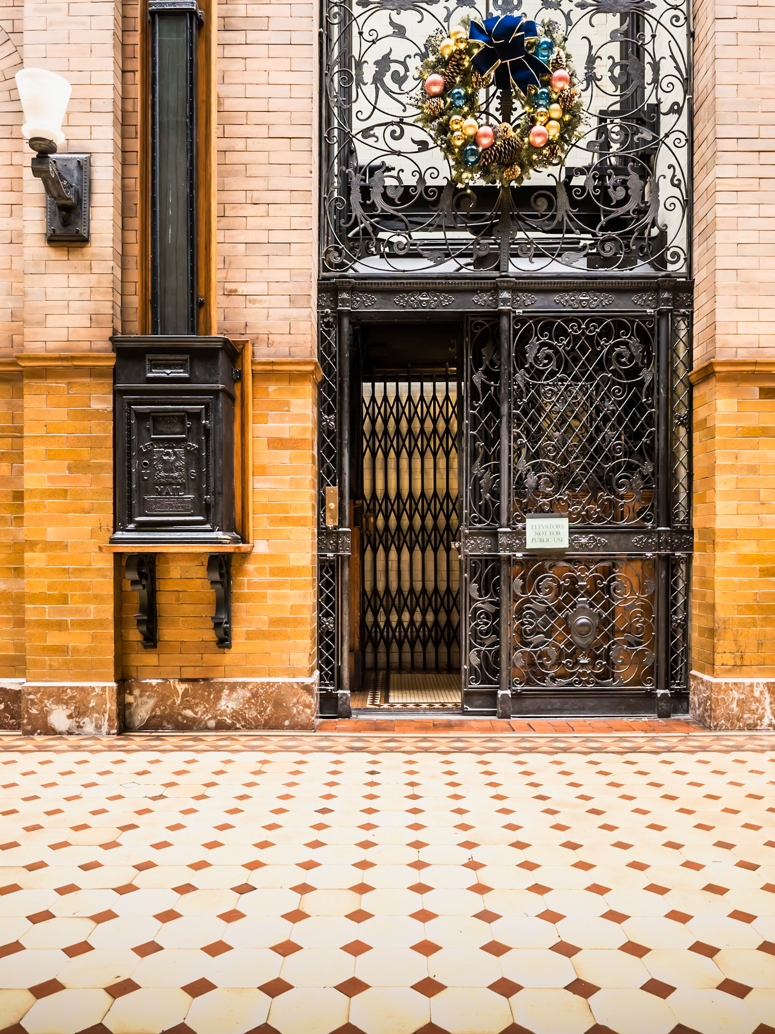 An old elevator awaits the first passenger of the day in the Bradbury Building in downtown Los Angeles