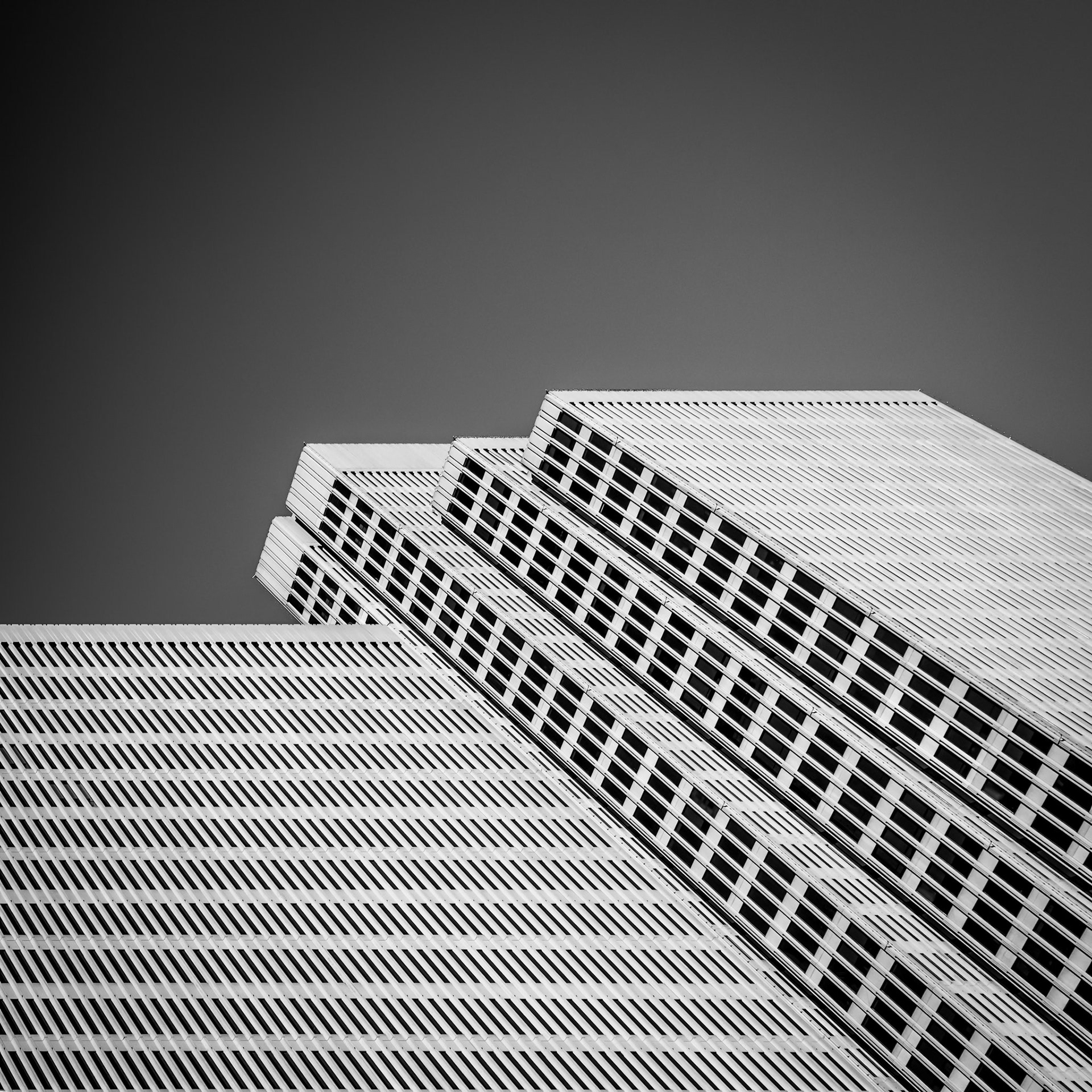 Dark windows of the Embarcadero Center contrast against the stark white of the Embarcadero Center in San Francisco