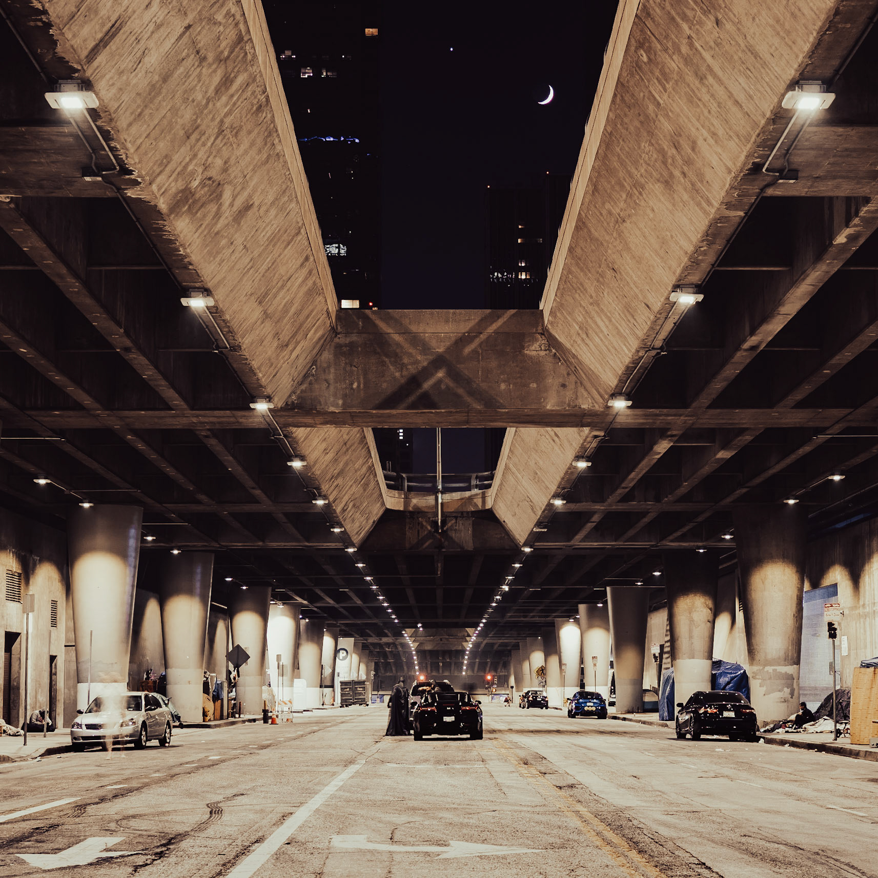 The planet Venus and the moon align with a partially subterranean street as they pass overhead downtown Los Angeles