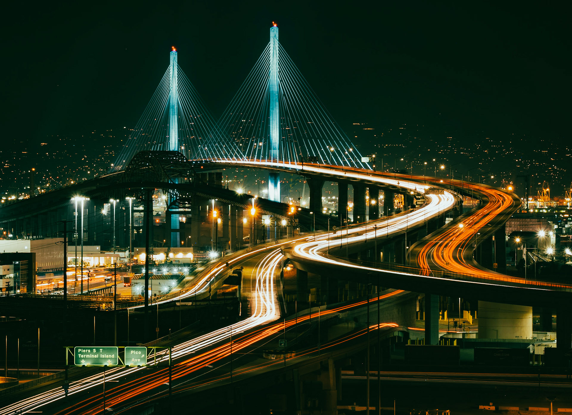 Rush hour traffic passes across the Long Beach International Gateway  bridge