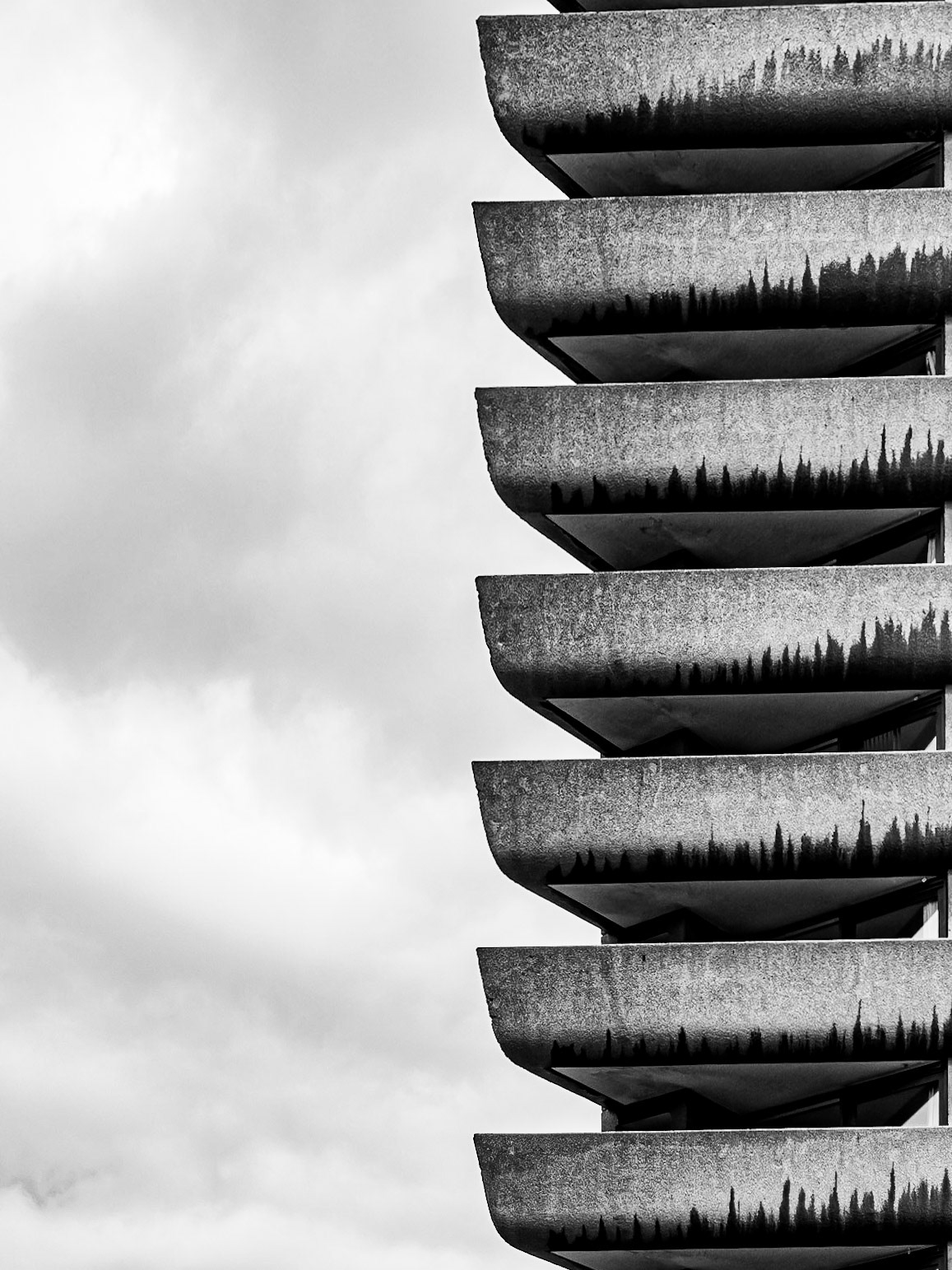 Balconies of a tower block poke into the sky in London's Barbican complex