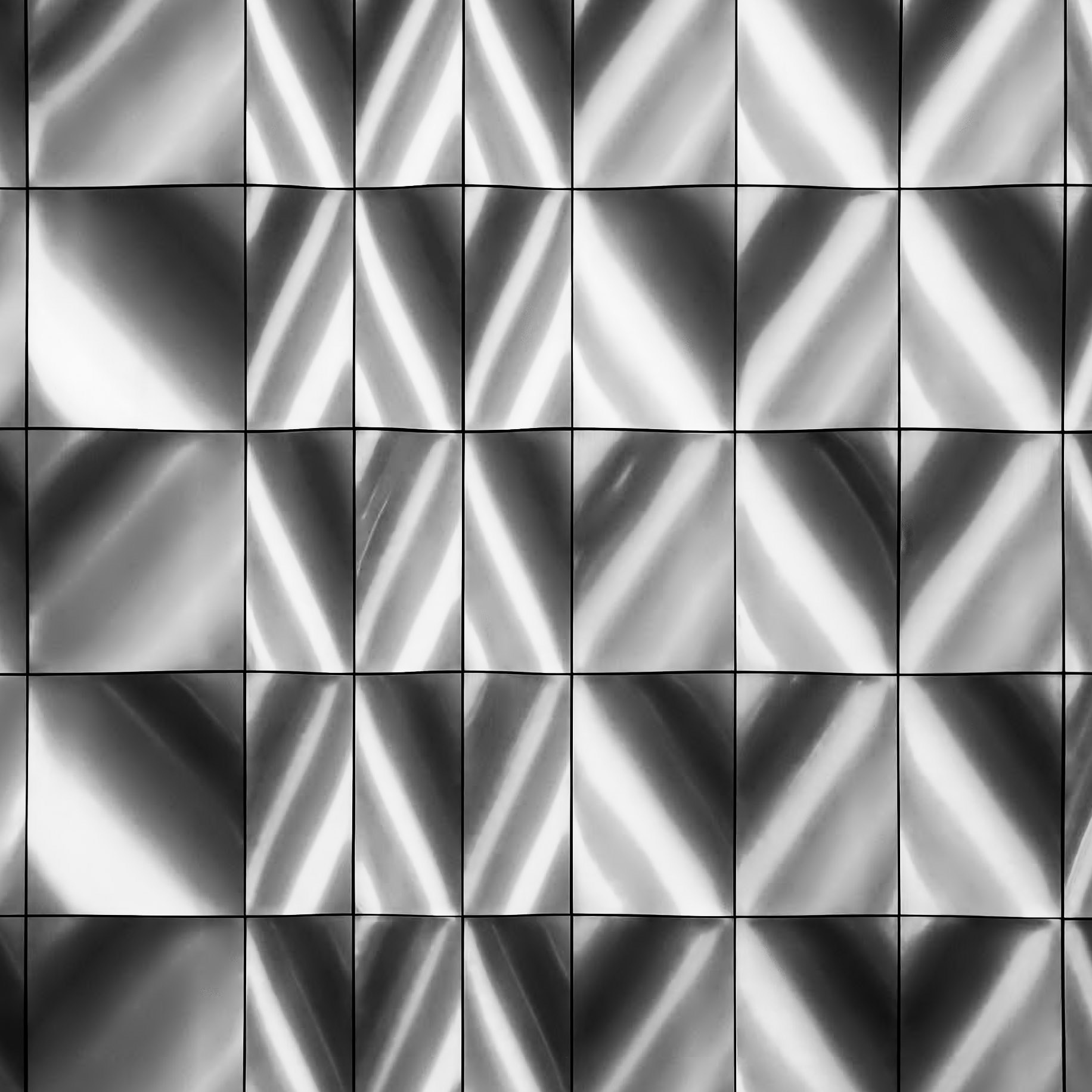 A rectangular grid of diagonal shapes