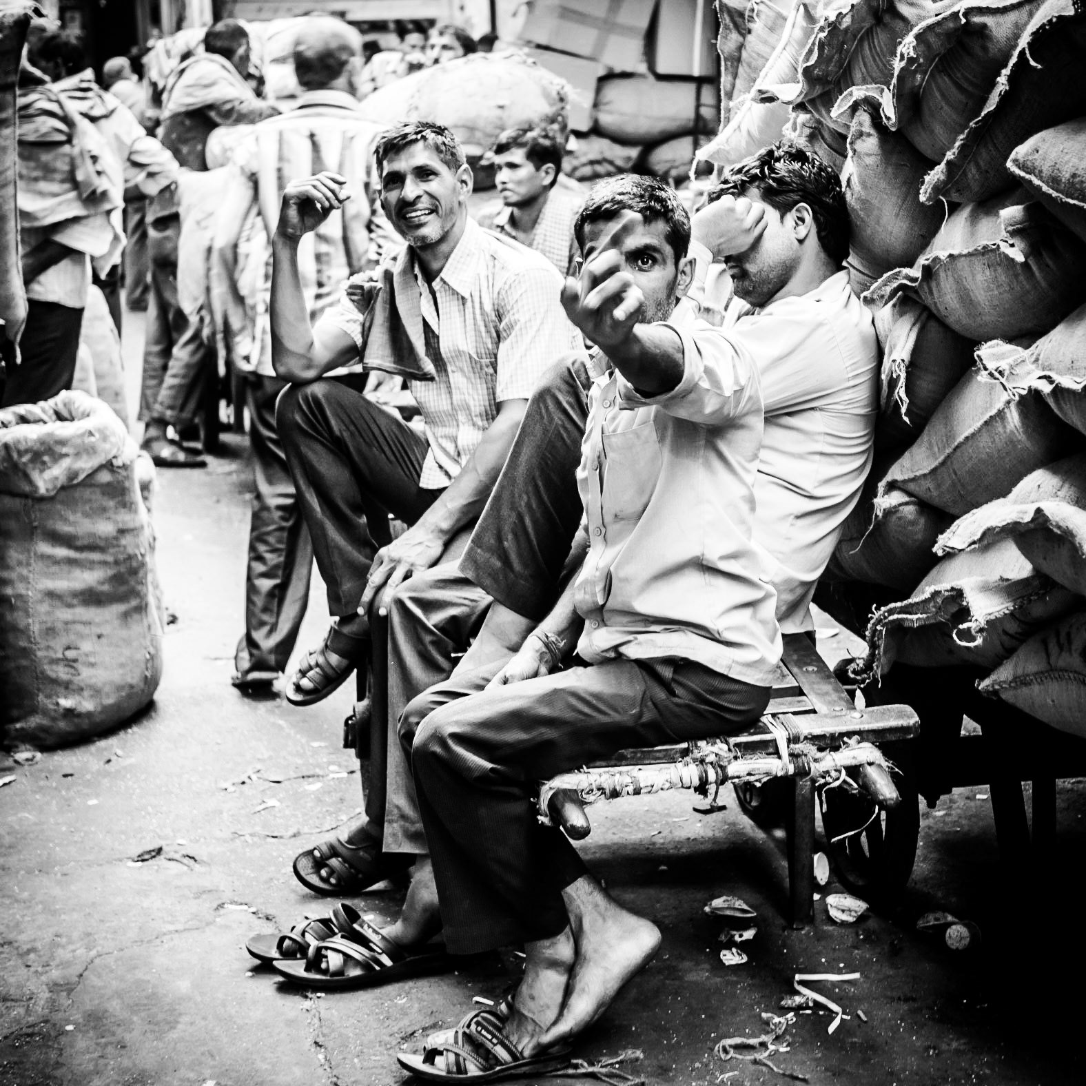 A porter becomes annoyed when his photo is taken in the Chandni Chowk market district of New Delhi