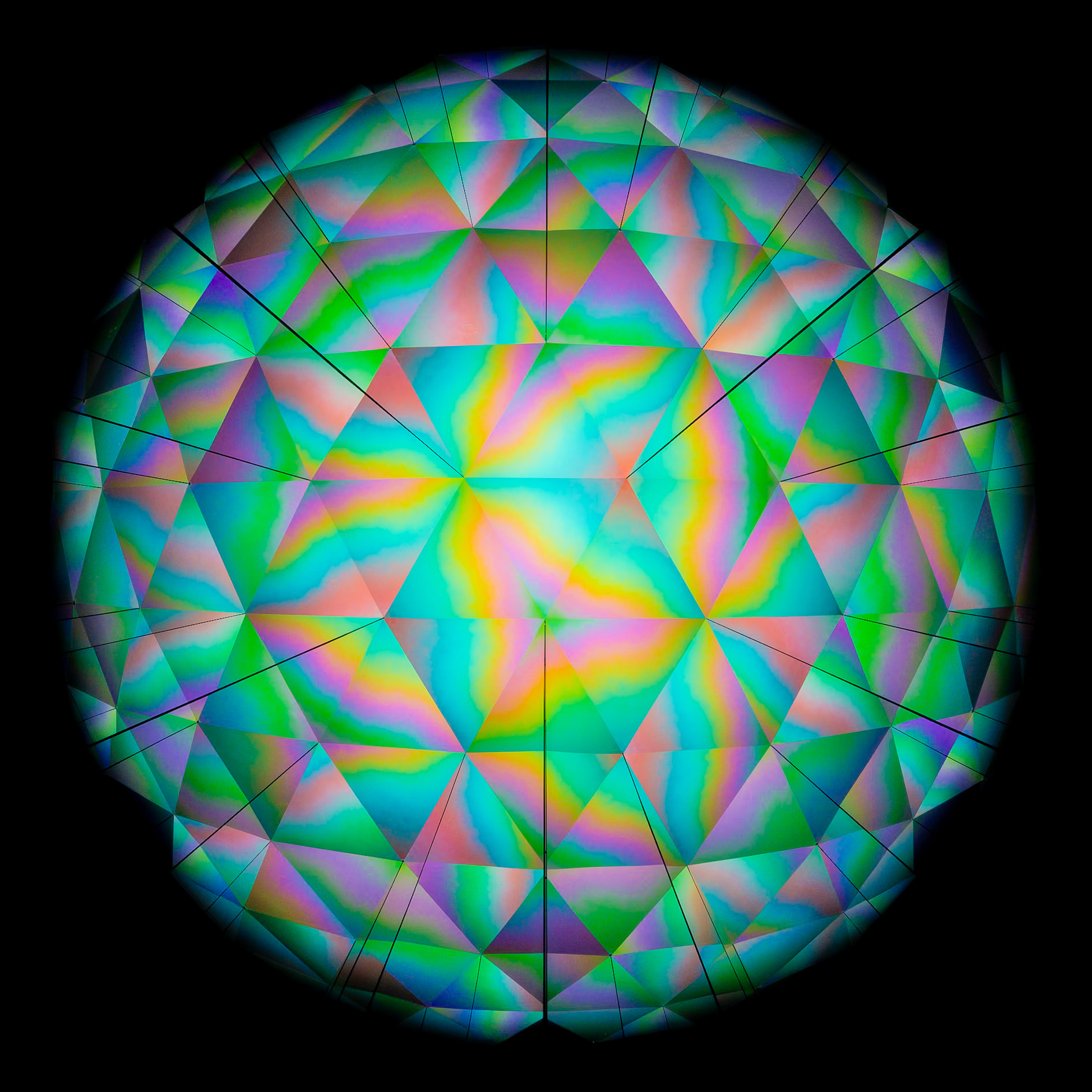 A mesmerizing sphere of kaleidoscopic facets, bursting with spectral hues and intricate symmetry, offers a glimpse into a world of refracted light and vibrant patterns