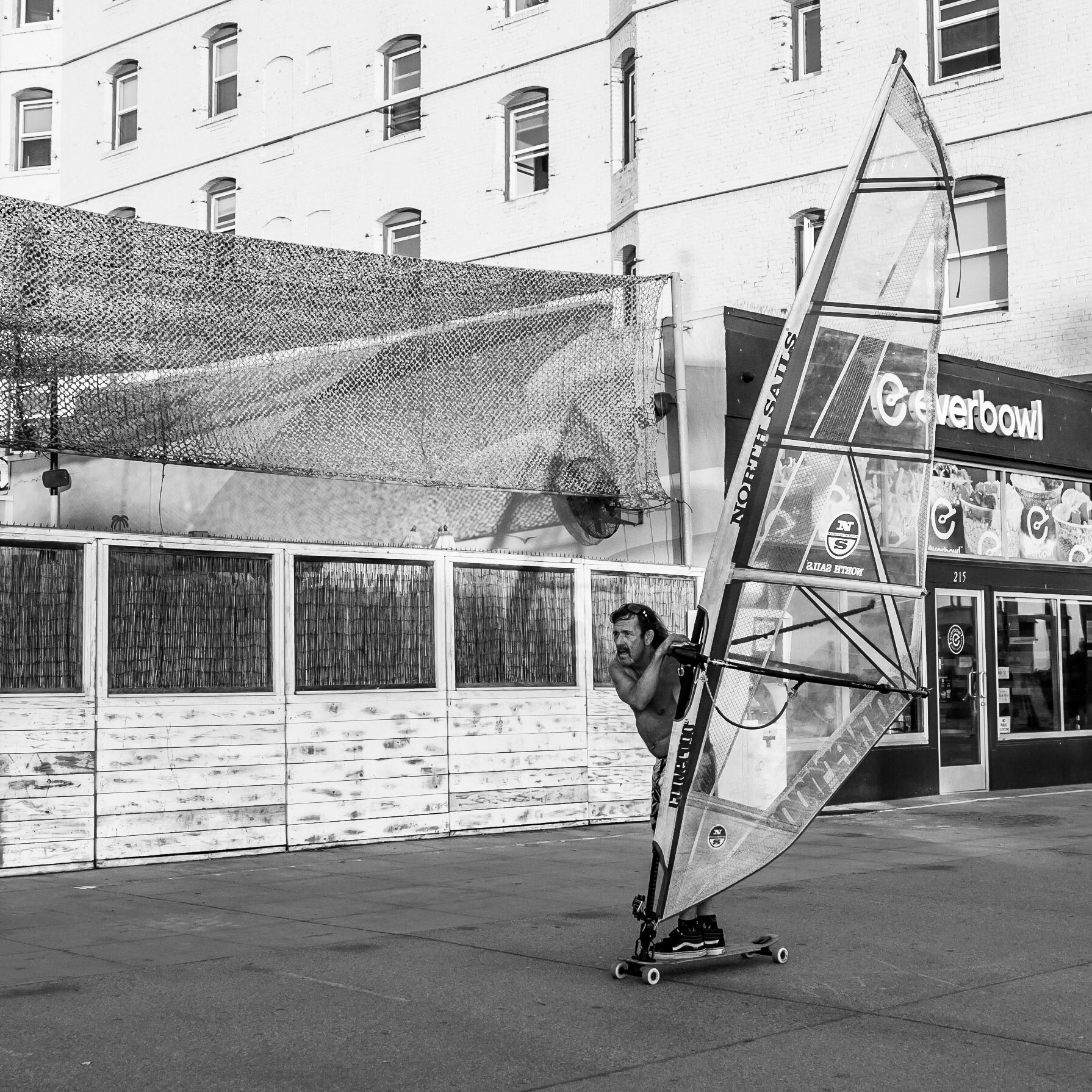 A local resident of Venice Beach races along the beachfront of Venice Beach on his unique form of transport