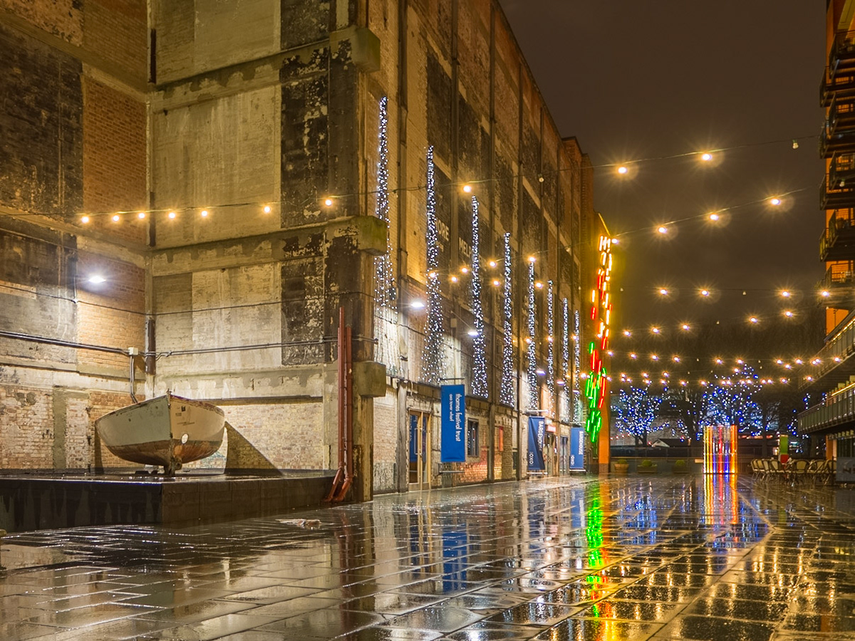 A deserted alleyway, colourfully-lit, off the Thames, London