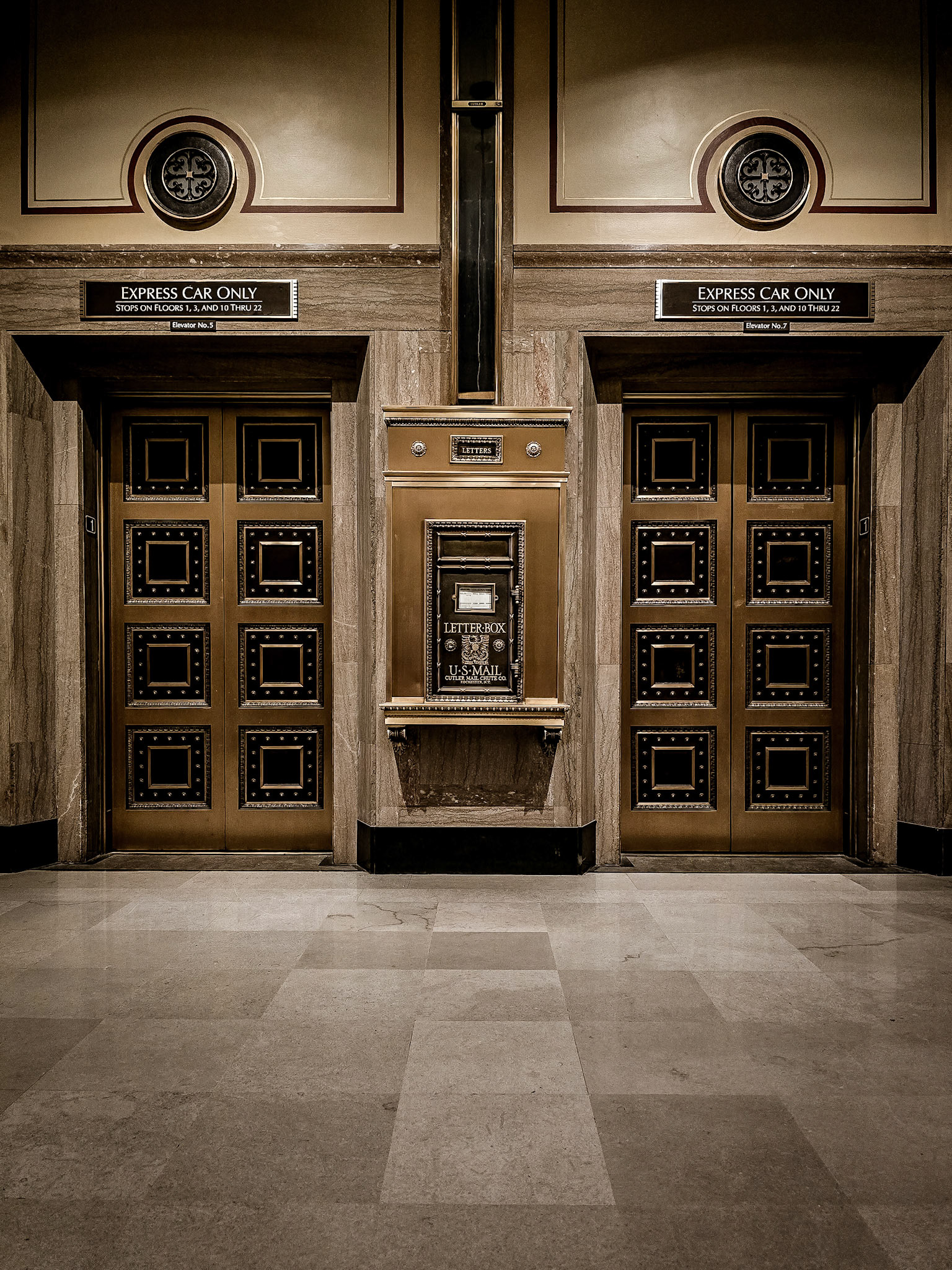 Vintage elevators stand in the haunting hallway of Los Angeles City Hall