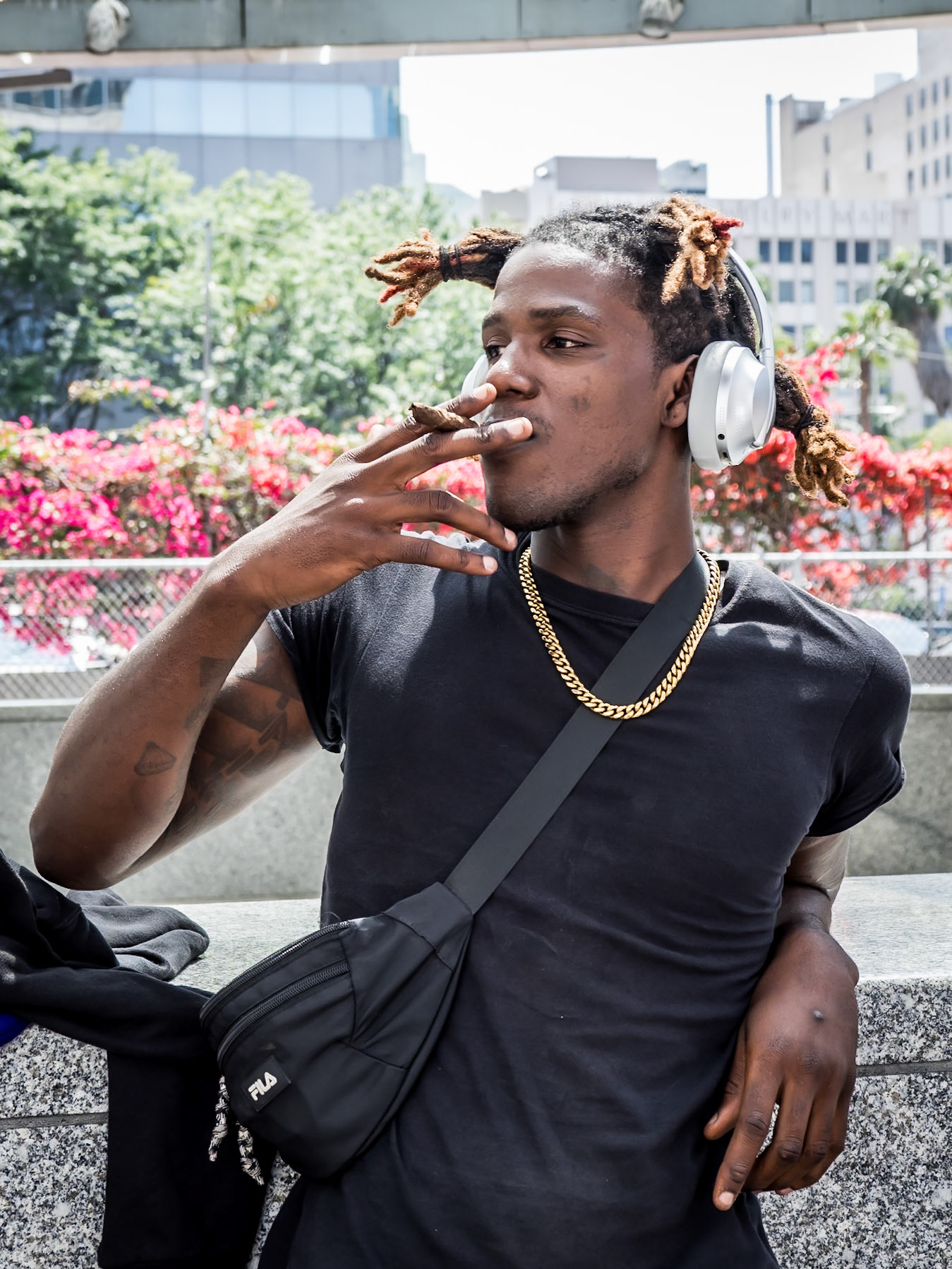 A local relaxes in the daytime heat of downtown Los Angeles