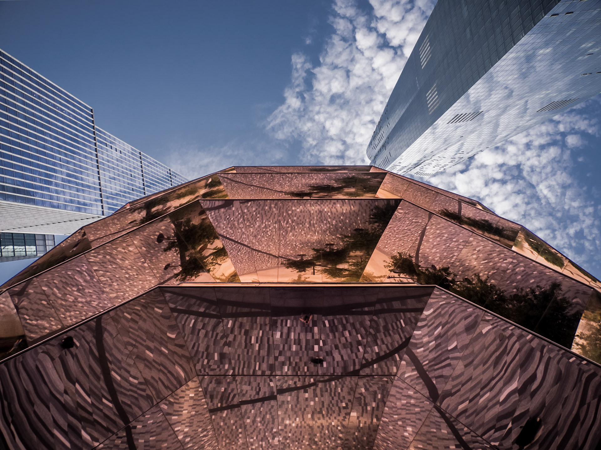 Reflections from the base of the Vessel, a unique strcture nestled amongst some of the tallest buildings in New York in the regenerated Hudson Yards district of Manhattan
