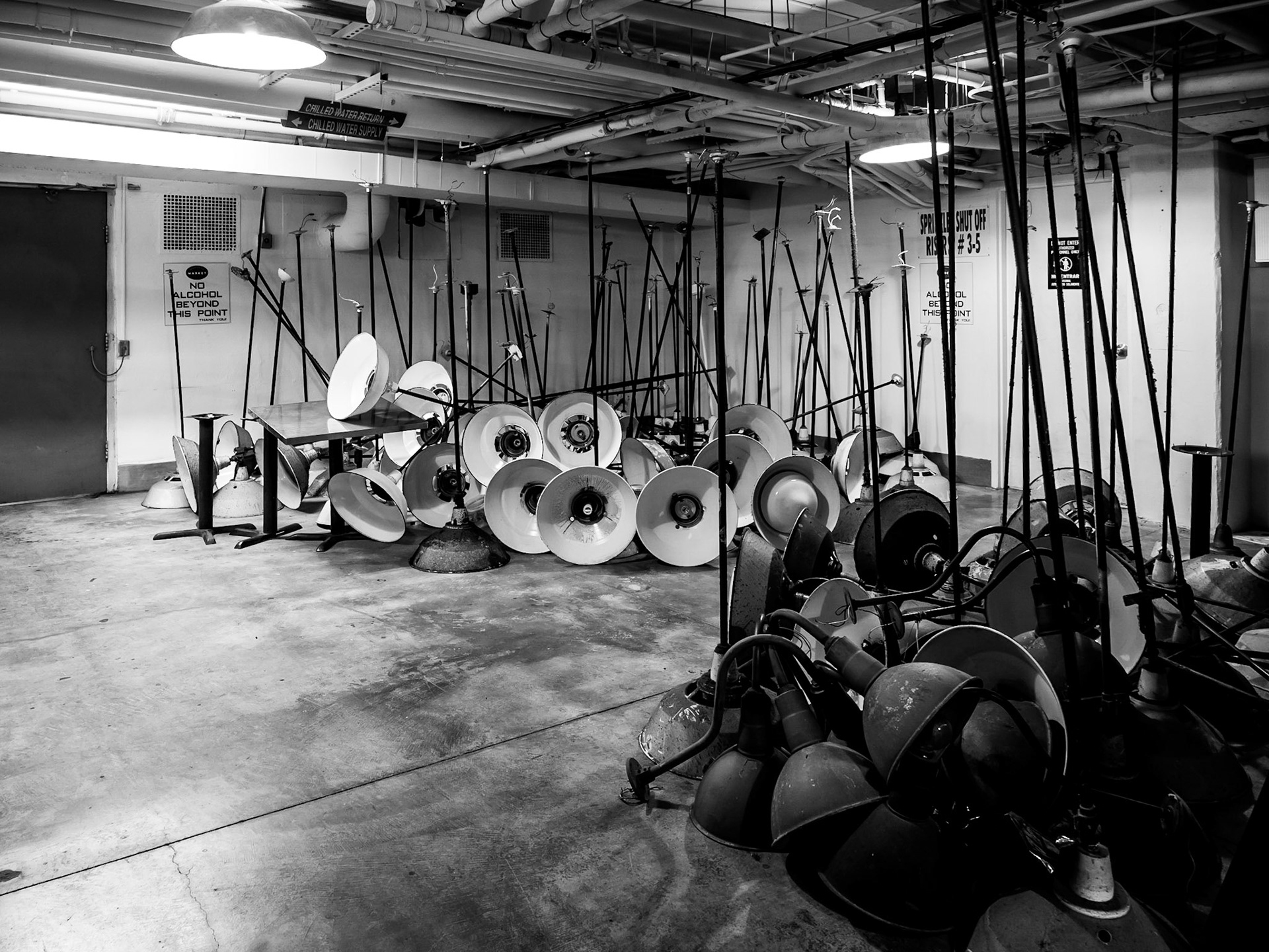 A collection of disused lamp stands stored in the basement of Grand Central Market food hall in downtown Los Angeles