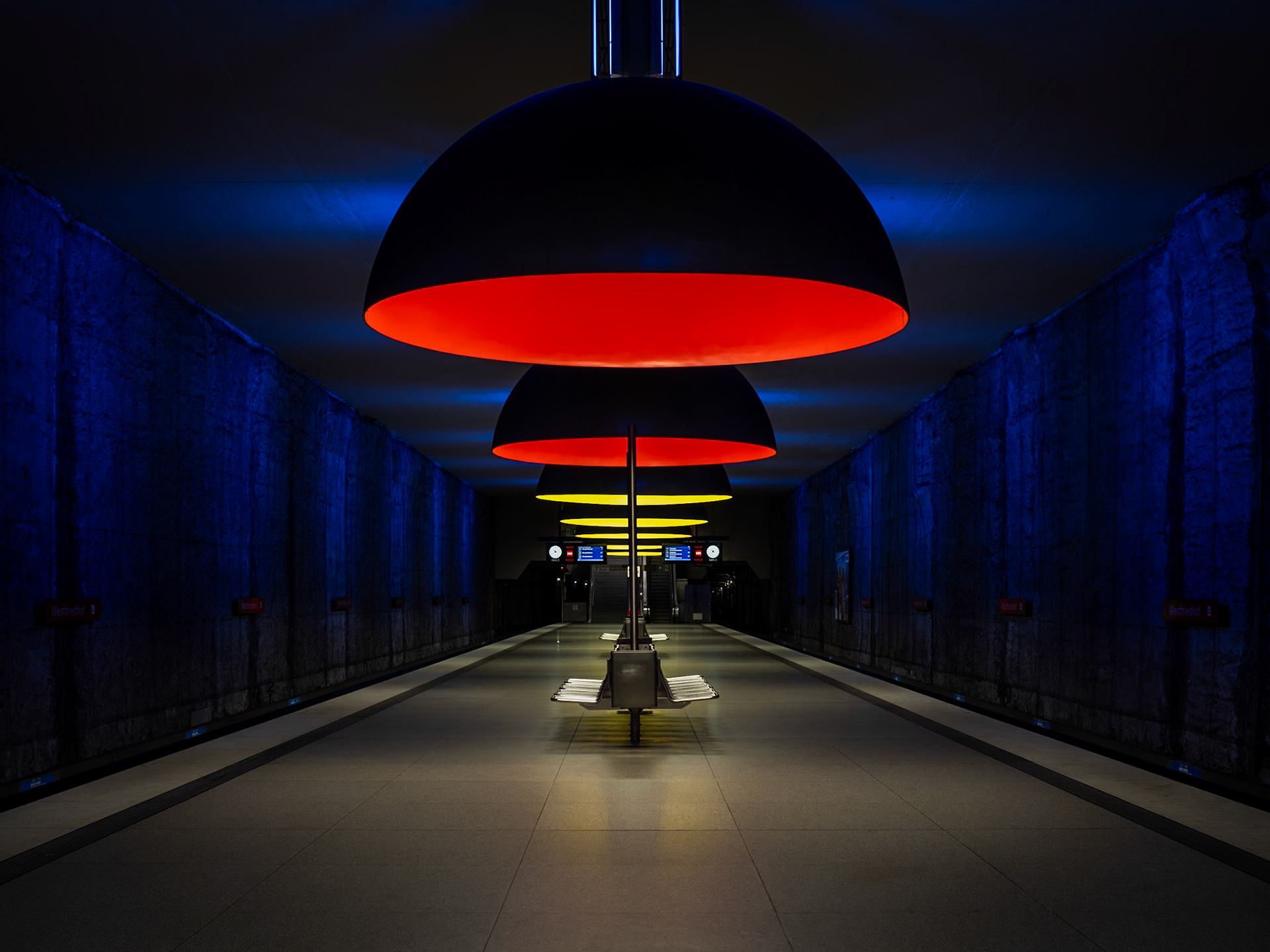 Colourful dome lights illuminate a deserted cavernous station on the U-Bahn in Munich