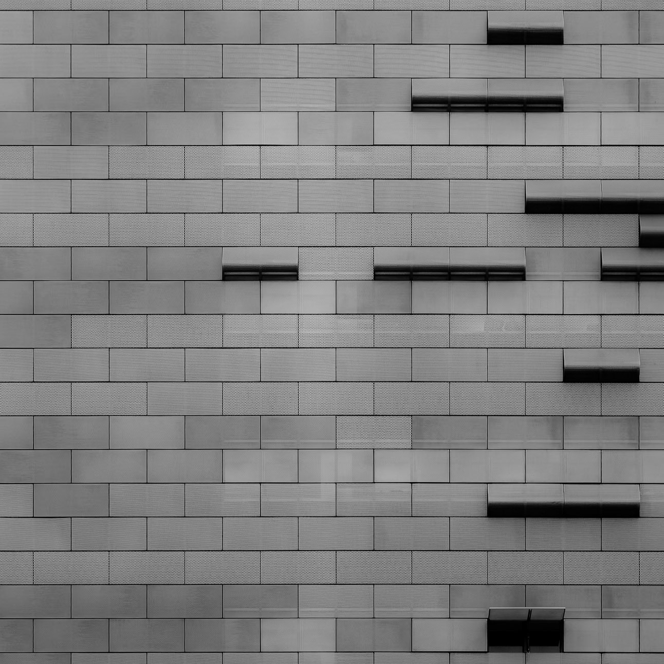 Brick-shaped panels line the side of an austere building in downtown Los Angeles