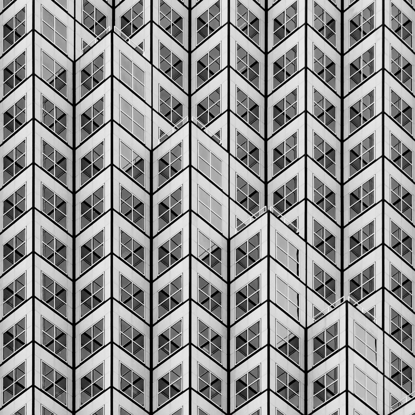 Windows of a building create a distinctive herringbone pattern
