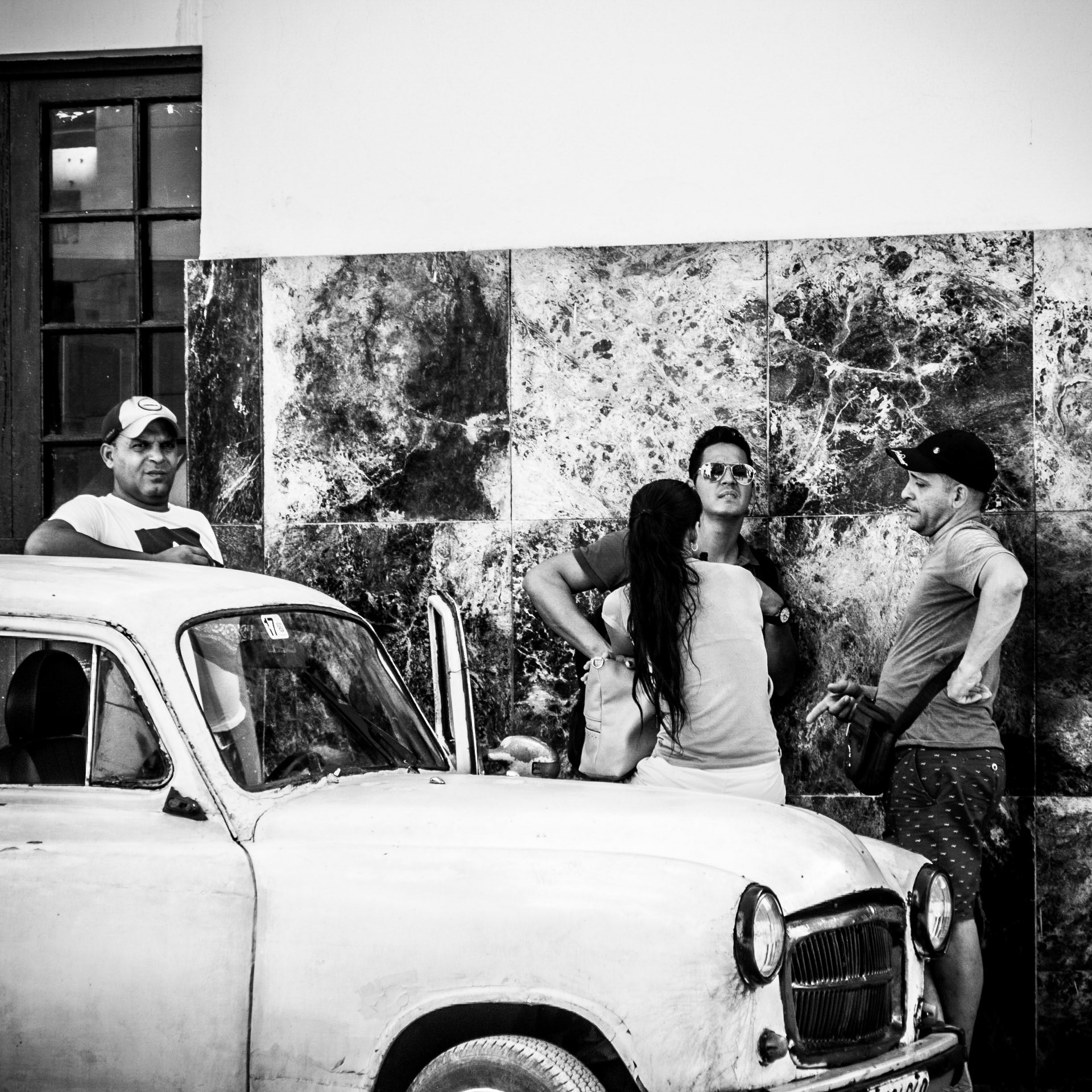 Havana residents have an animated discussion on one of the capital's streets