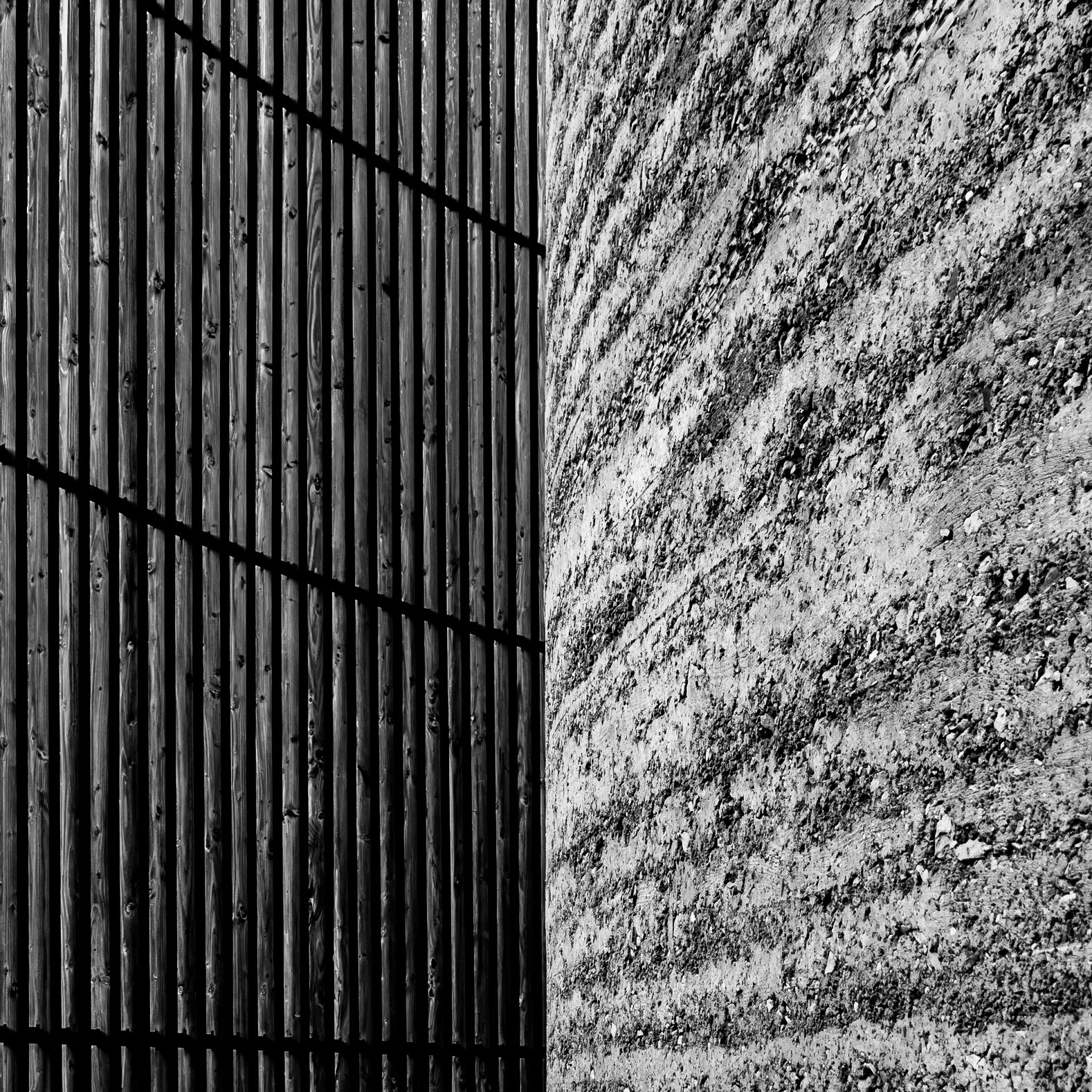 Contrast is created in a church in Berlin by the pairing of a concrete interior wall that is sheltered by an external wooden shutter