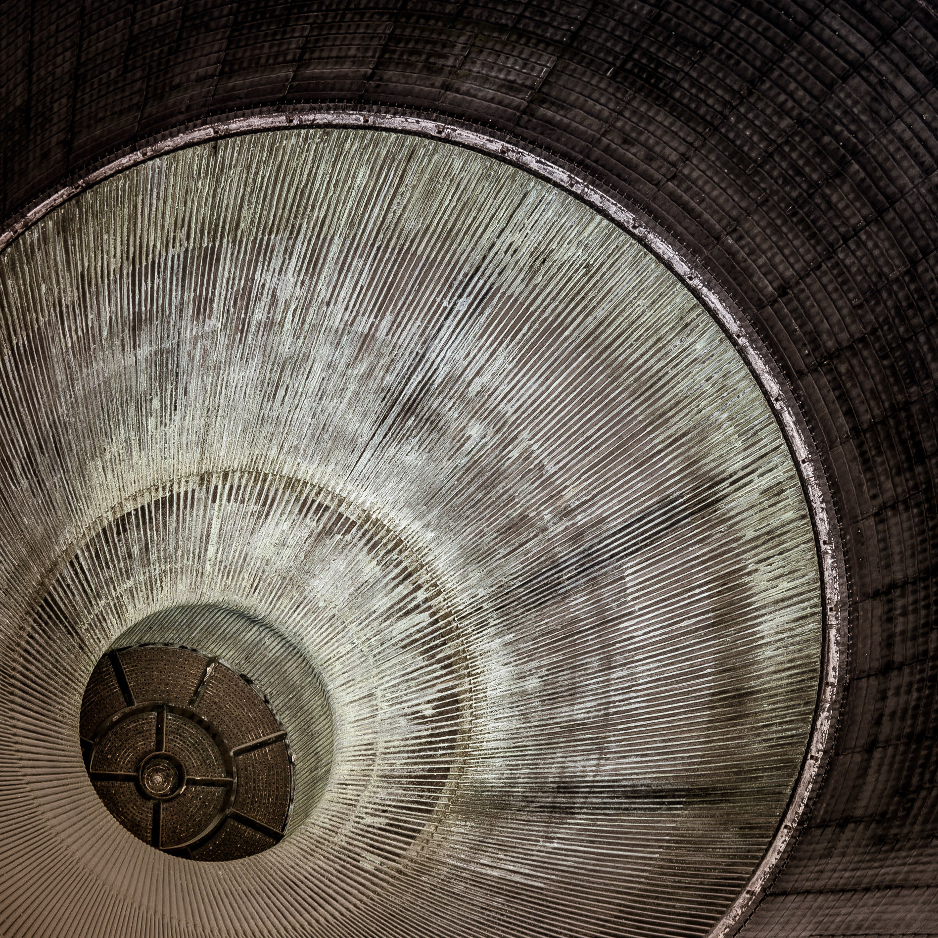 Scars line the geometric interior of one of the nozzles of the Saturn V space rocket in the Kennedy Space Center at Cape Canaveral in Florida