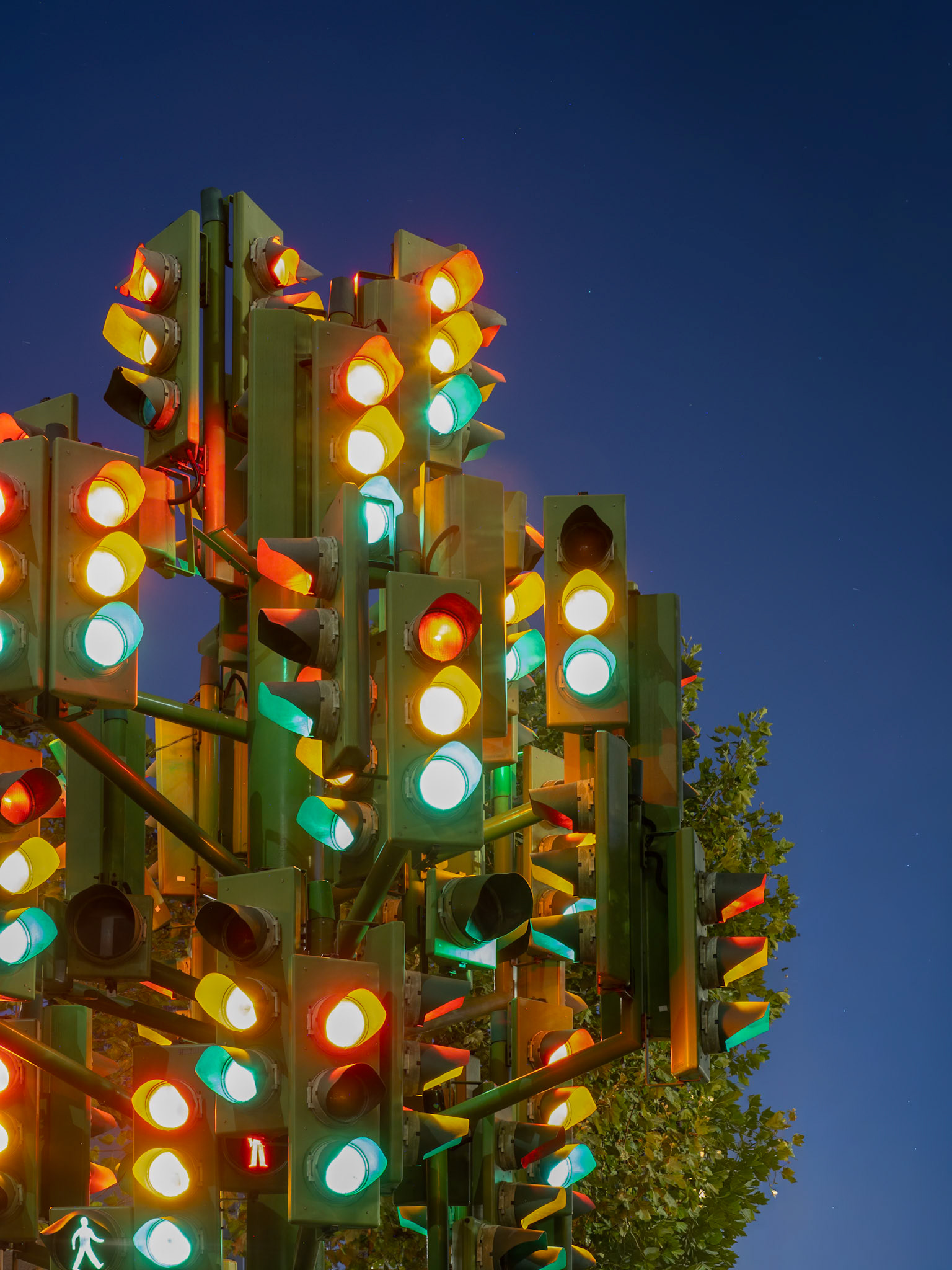 Muliple colours shine from a collection of traffic signals that form a contemporary art installation in the City of London