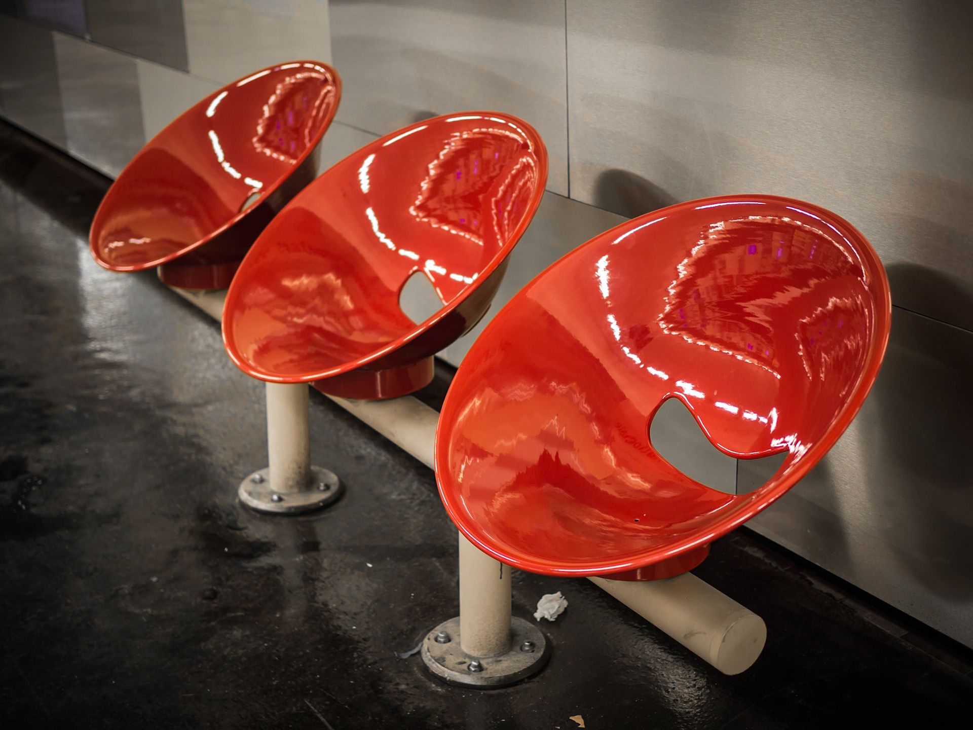 Distinctive bright red seats await commuters on the Metro in central Paris