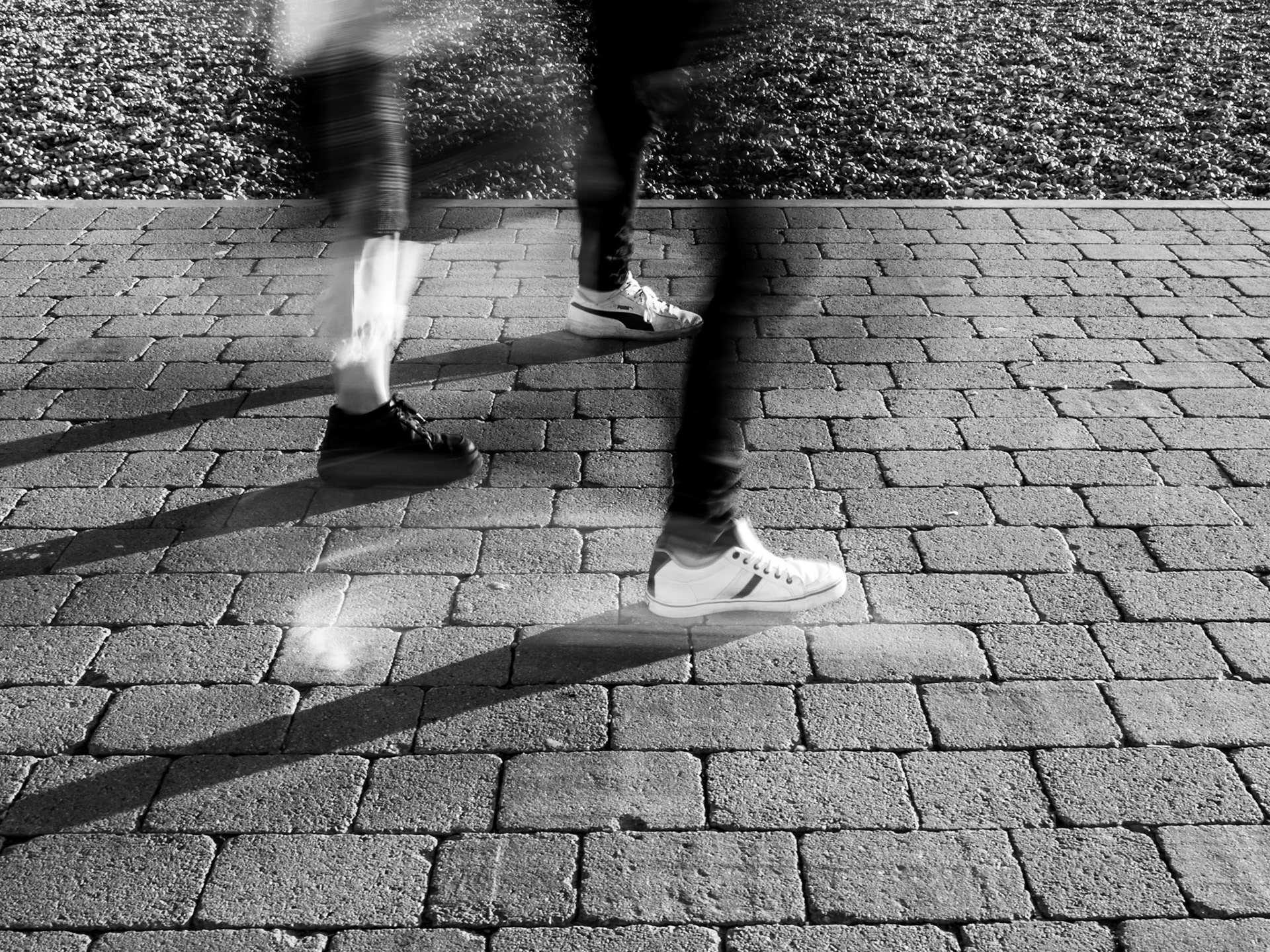 The busy feet of joggers running along the seafront in Brighton in Sussex