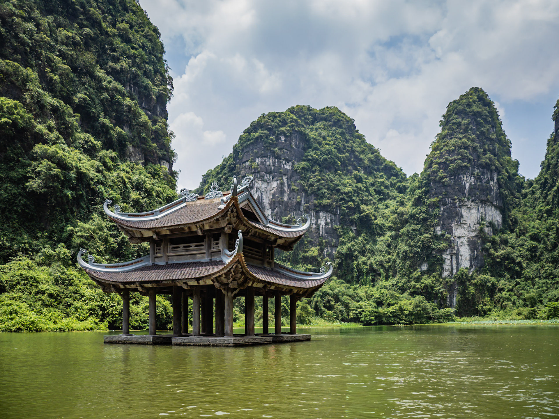 Nestled in the limestone mountains of the region of Ninh Binh in Vietnam, a folly temple lies dormant before the daily rush of tourists begins