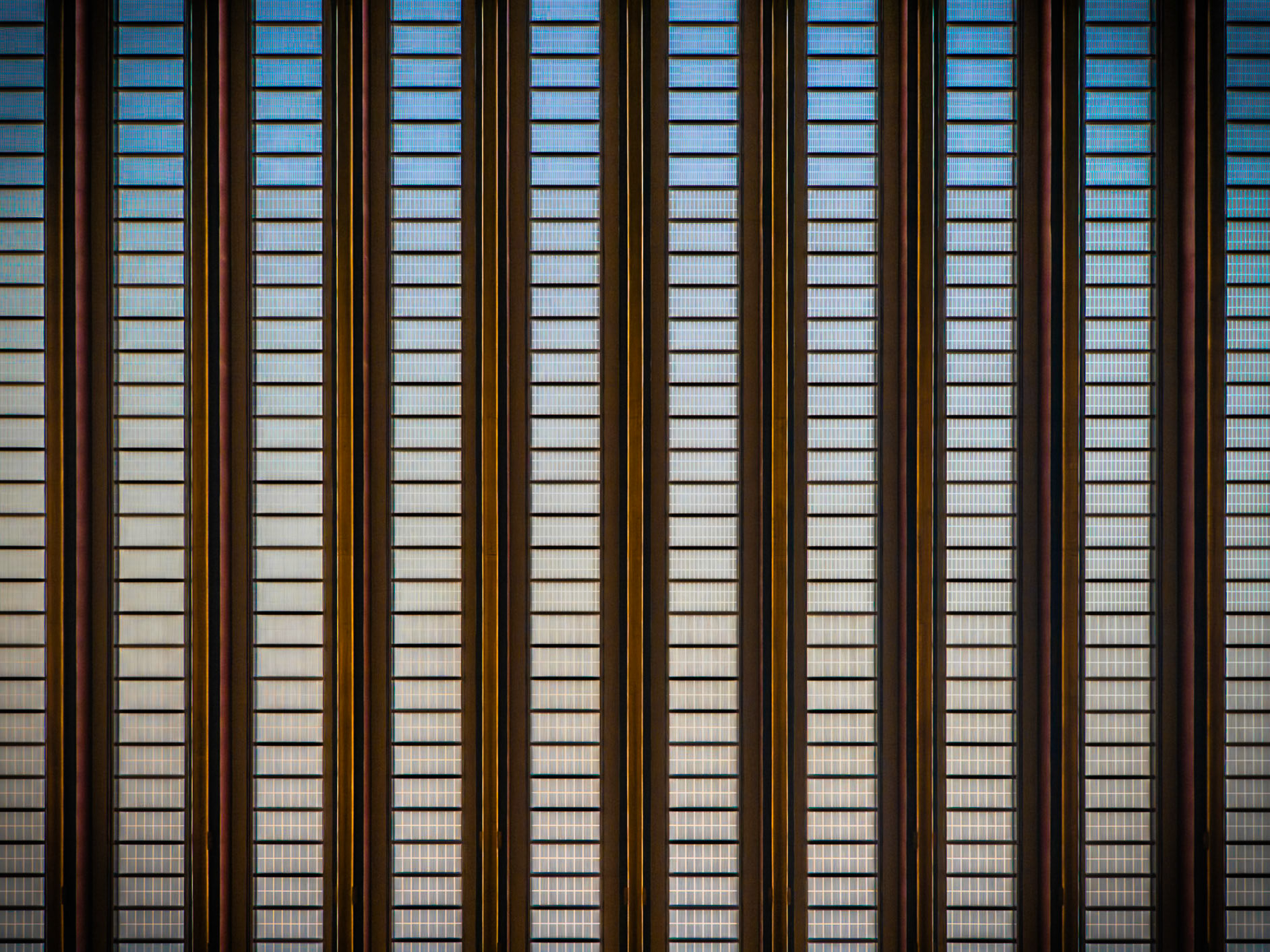 Multiple panes of glass form a vast wall of a building of the United Nations in Manhattan, New York