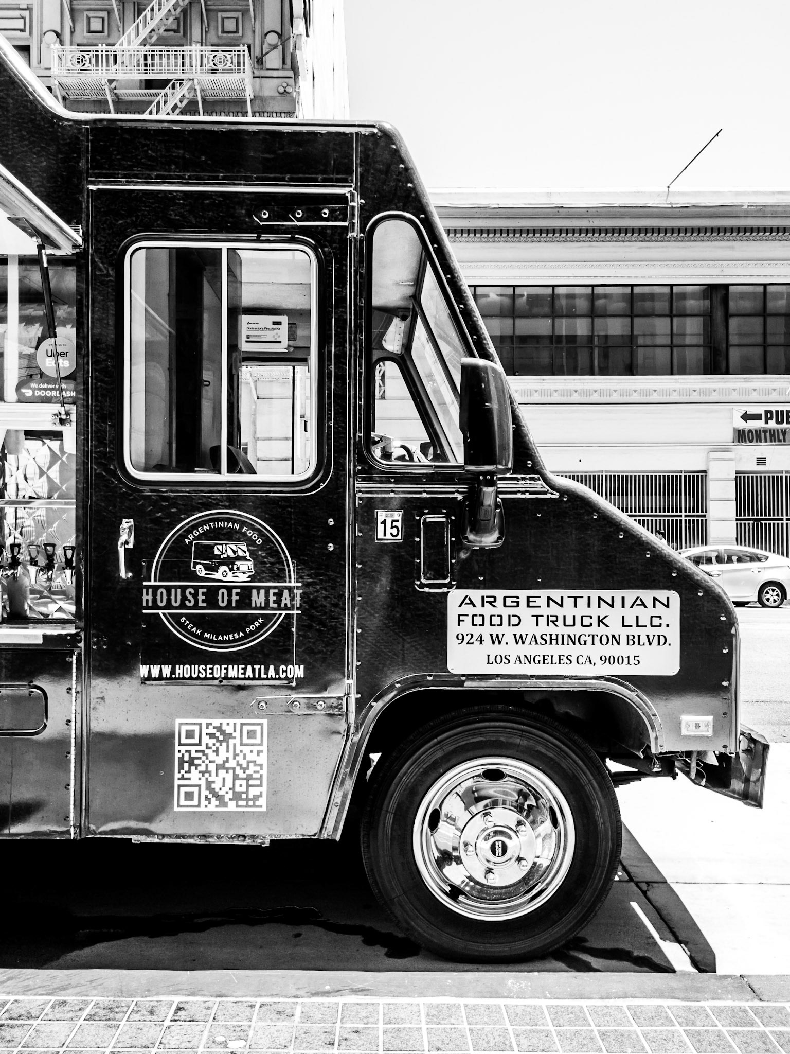 A catering truck specialising in meat sets up shop on a street in downtown Los Angeles