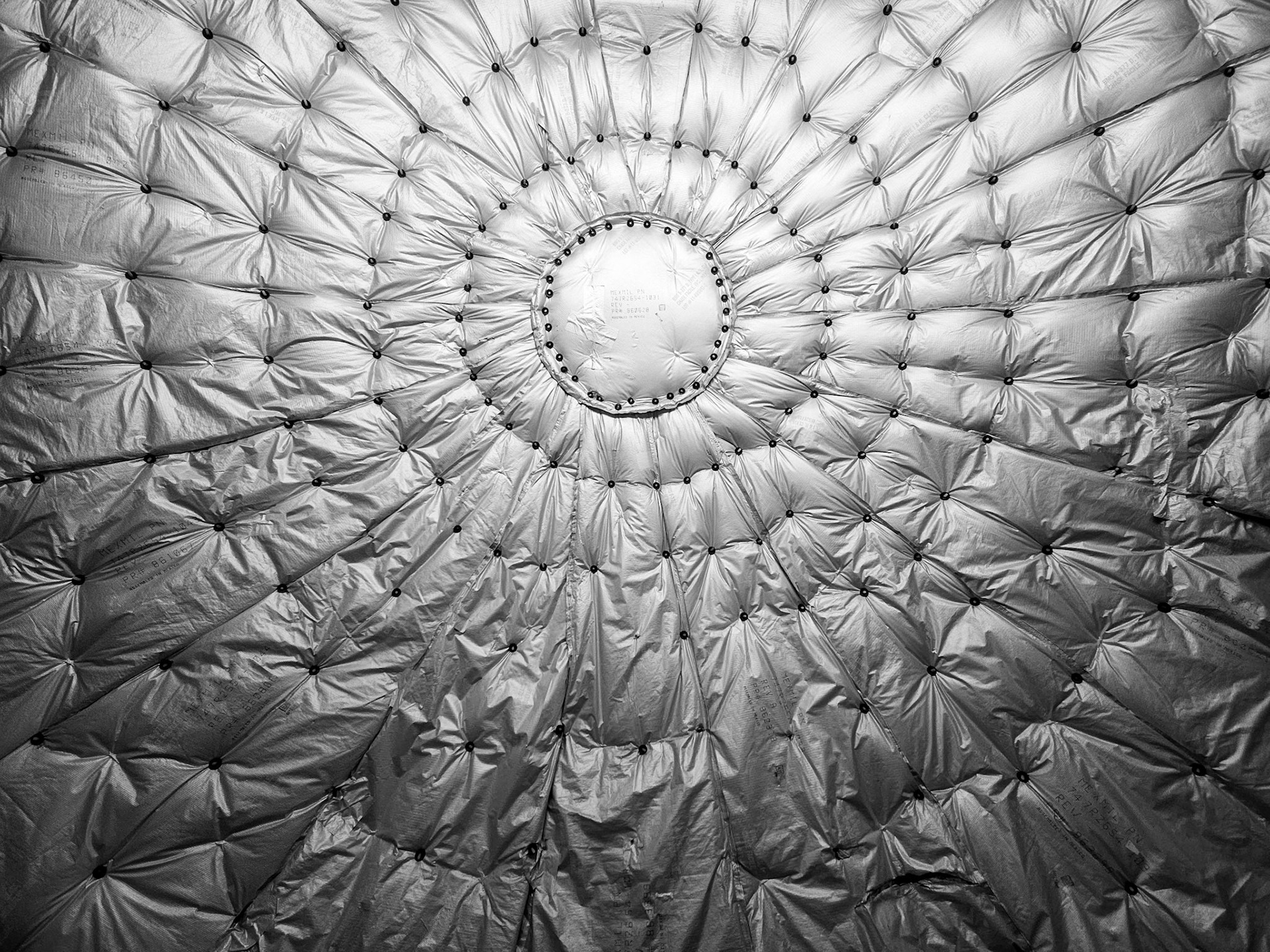 Quilted thermal insulation lines the pressure bulkhead at the back of a Boeing 747 airliner