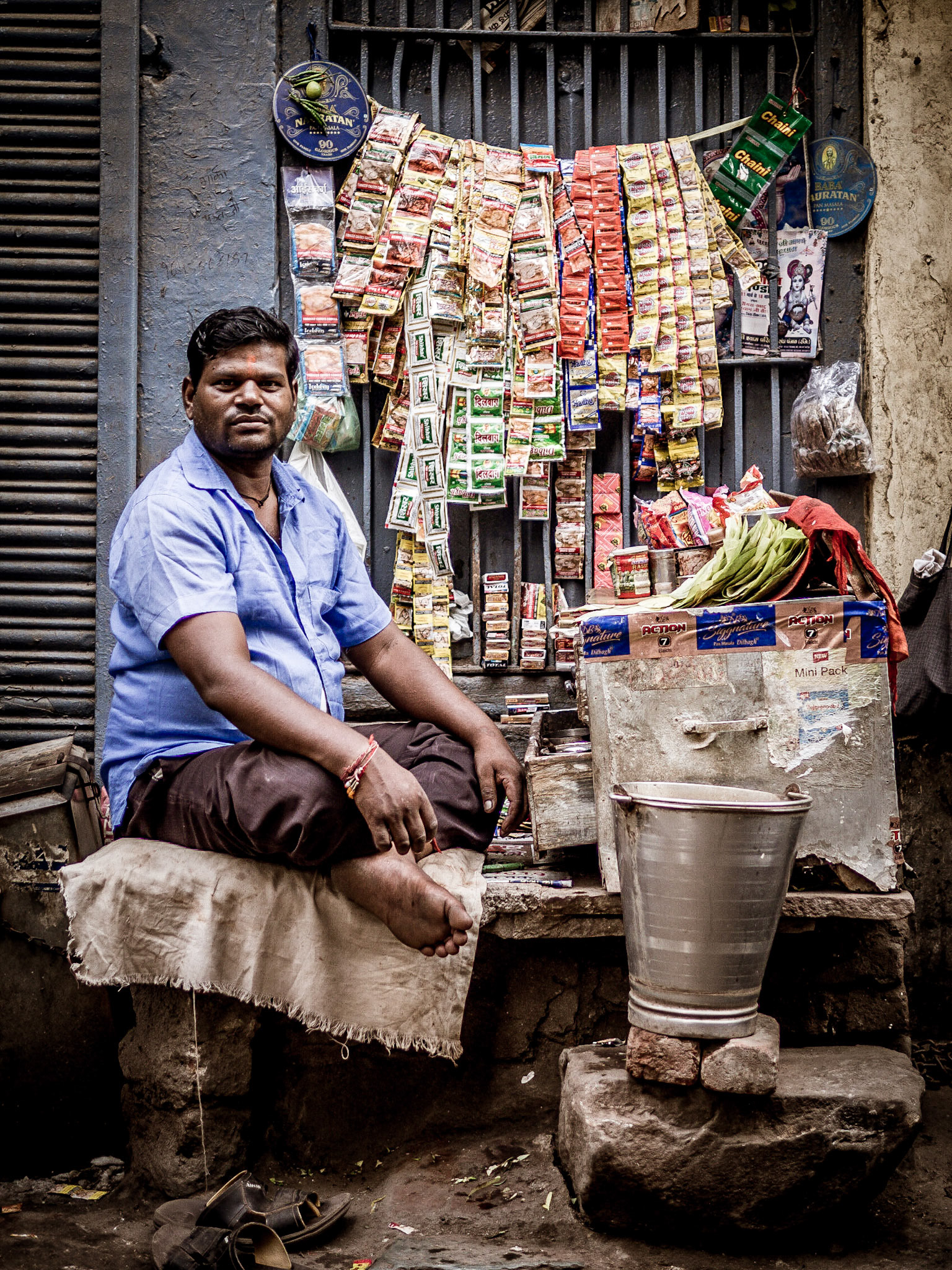 A stall-holder stands proud in a back-alley of New Delhi's Chandni Chowk market district