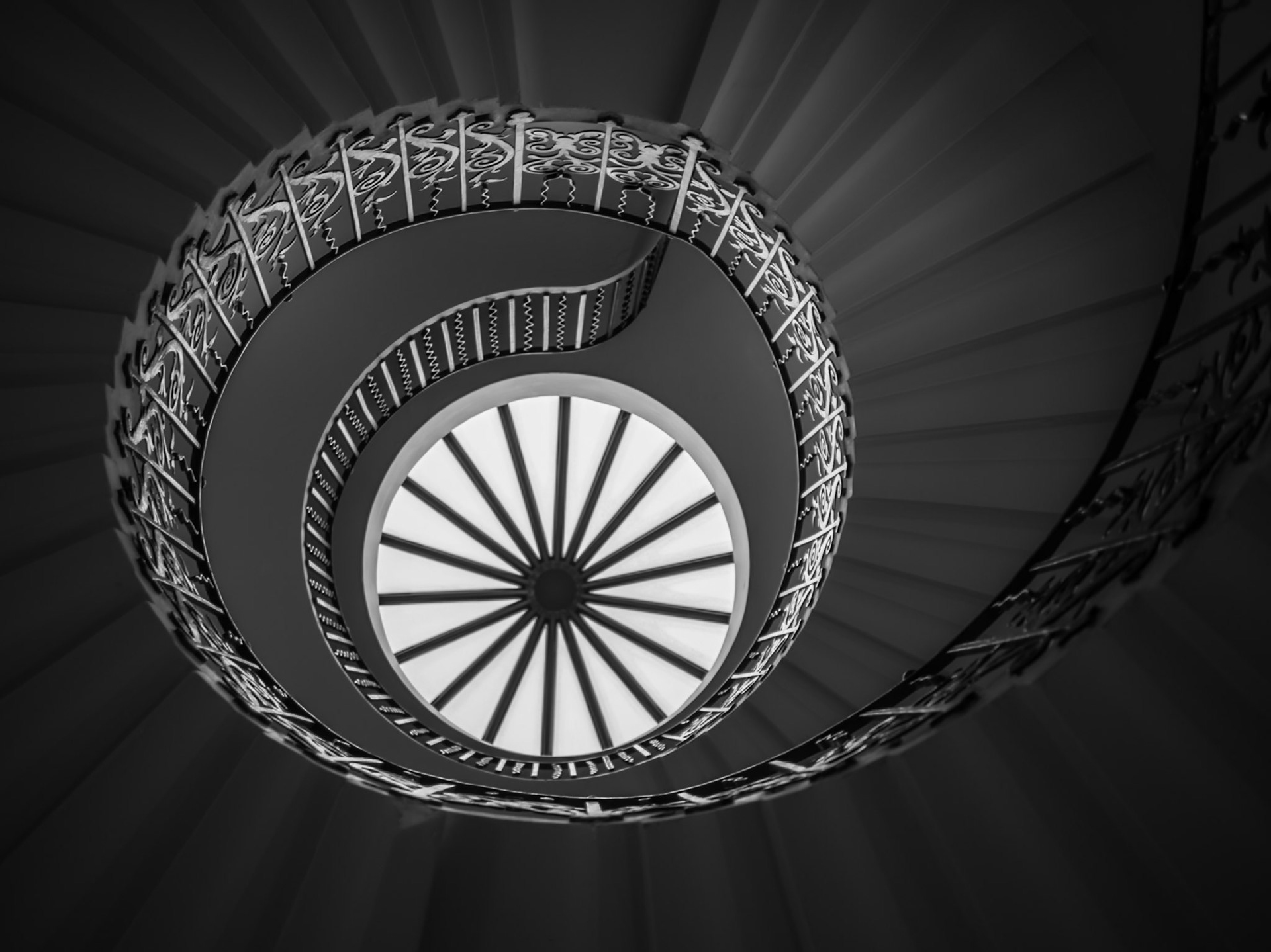 A beautiful spiral staircase forms the shape of an eye and its pupil