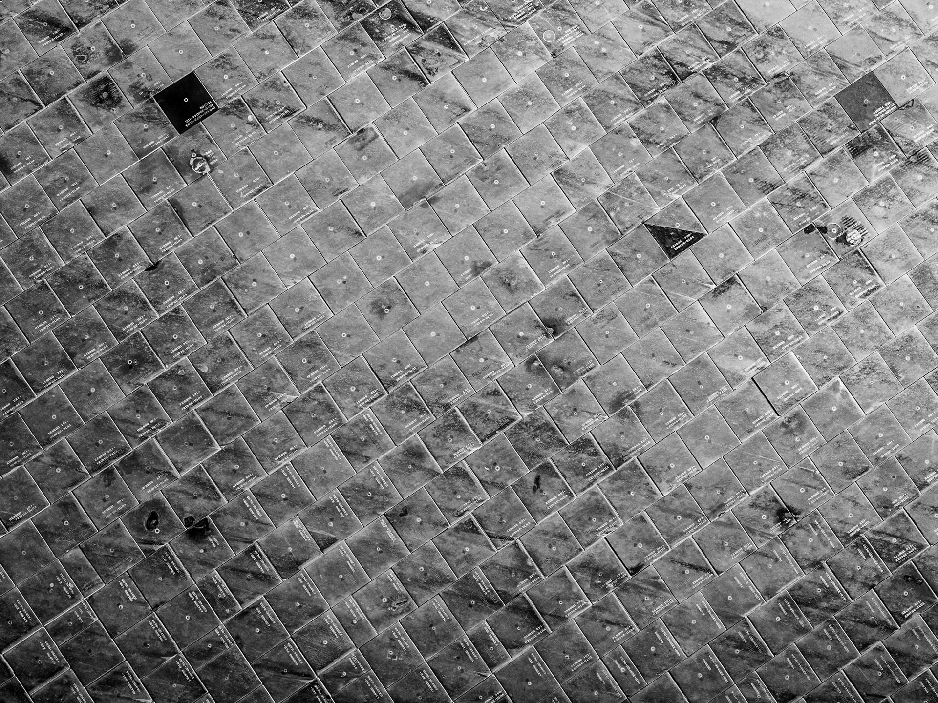 Scarred tiles of the underside of the space shuttle Atlantis at the Kennedy Space Center at Cape Canaveral in Florida