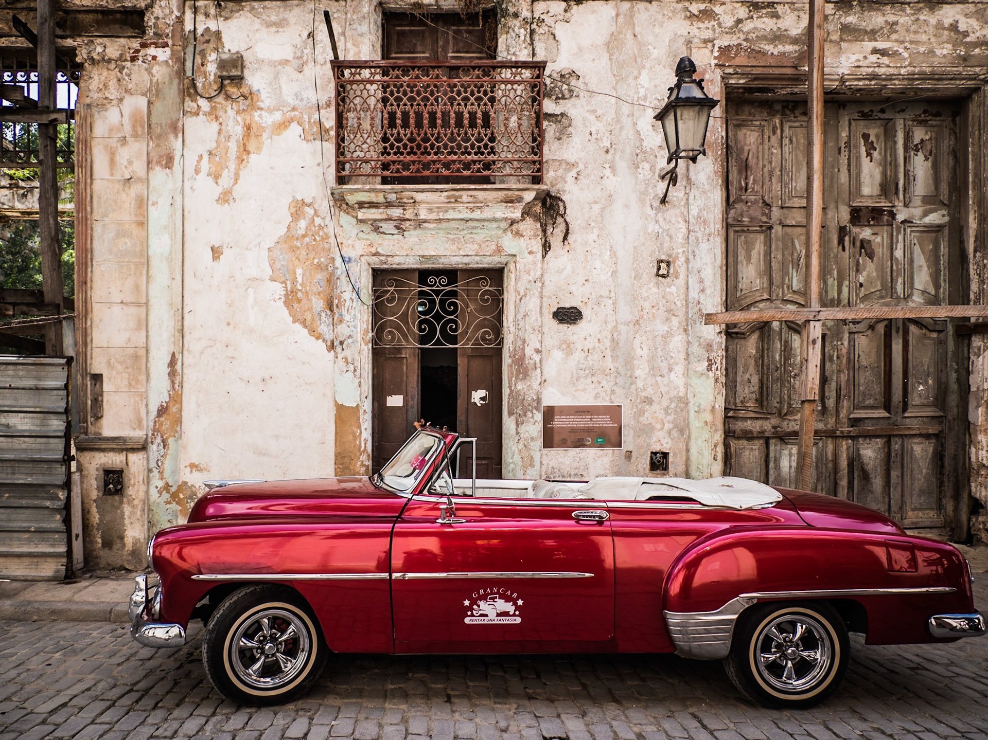 A vintage car stands in a street in Havana, the capital of Cuba
