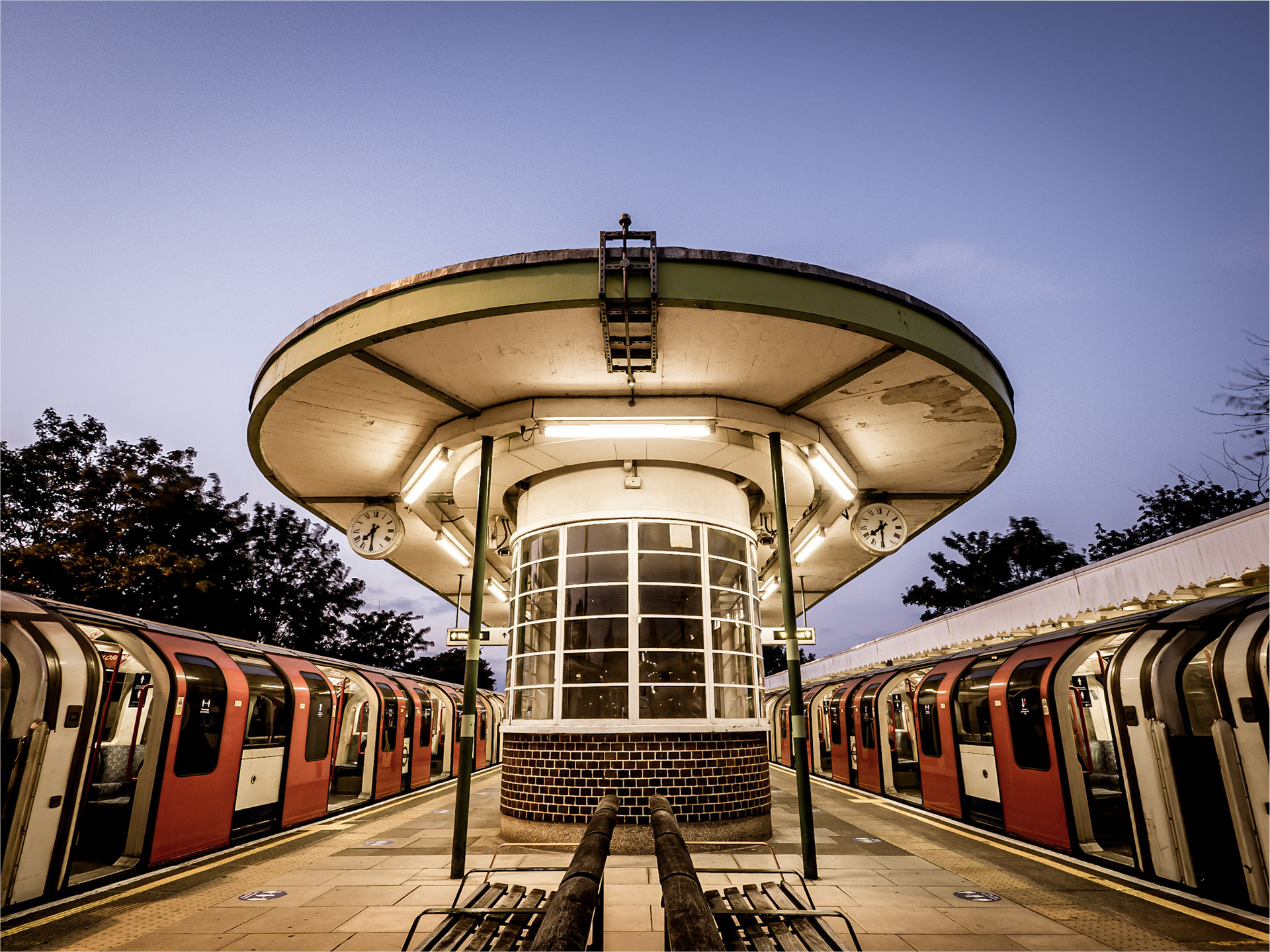 Dusk falls behind the waiting room at Hainault tube station in Essex